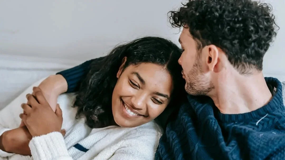Couple smiling and hugging