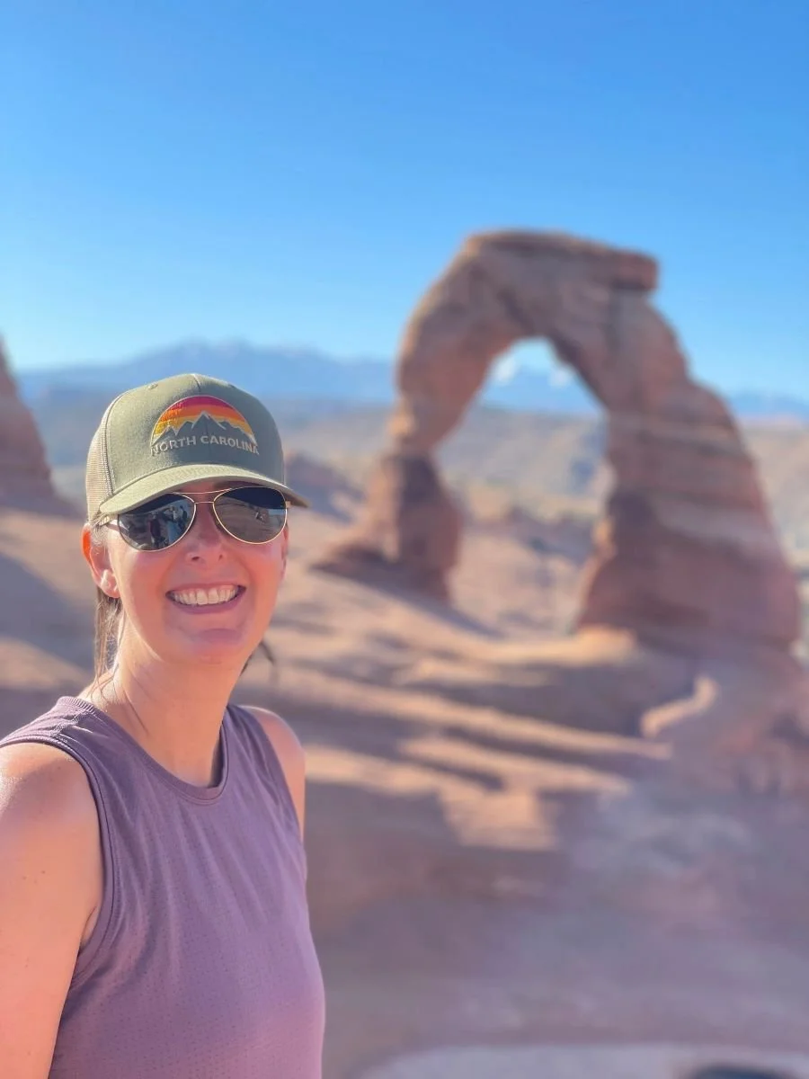 Kristin Nakhla, Holistic, Christian Counselor for women and teen girls smiling by the Arches in Moab, Utah.