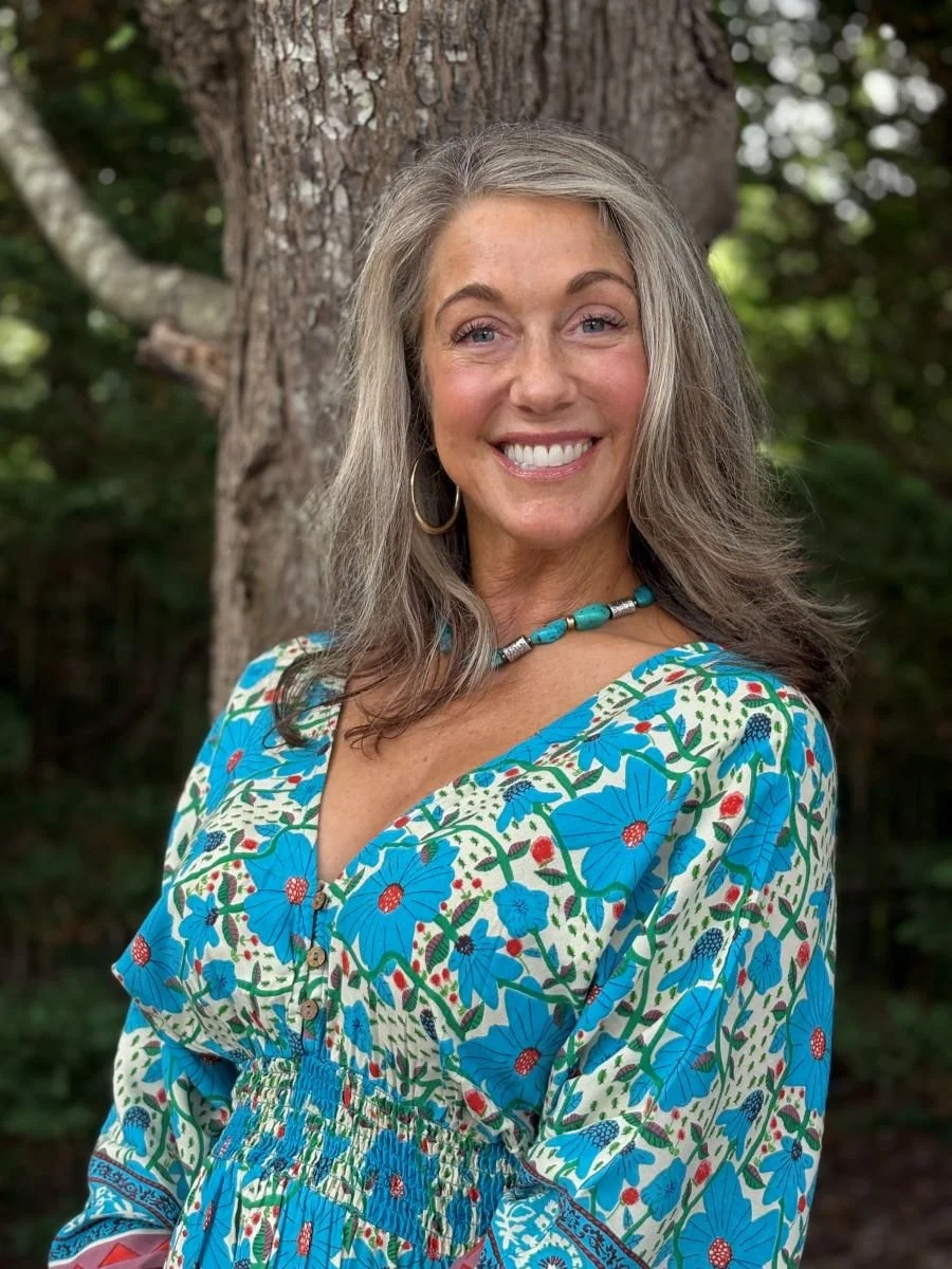 Beth Carrington Brown smiling outside the Cary office.