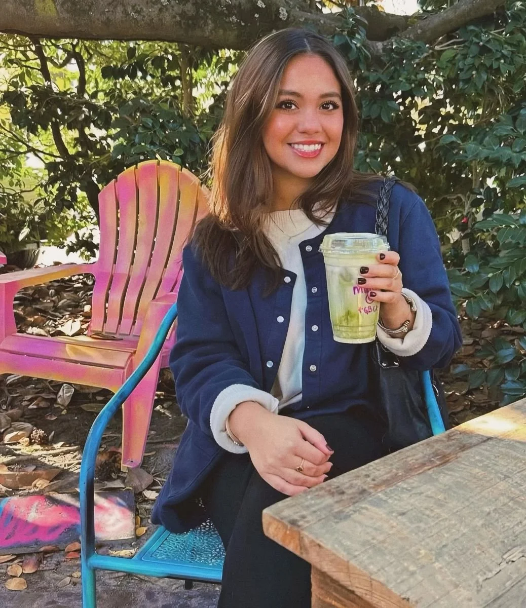Ashley enjoying a matcha latte outside.