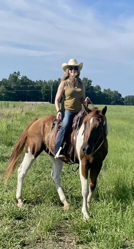 Beth riding one of her horses.