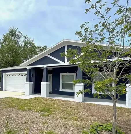DUNEDIN VACATION HOME Blue Jay Bungalow in Dunedin, Florida — a stylish, fully furnished 3-bedroom vacation rental home with an updated coastal exterior, attached garage, and ideal location close to downtown Dunedin and Honeymoon Island.