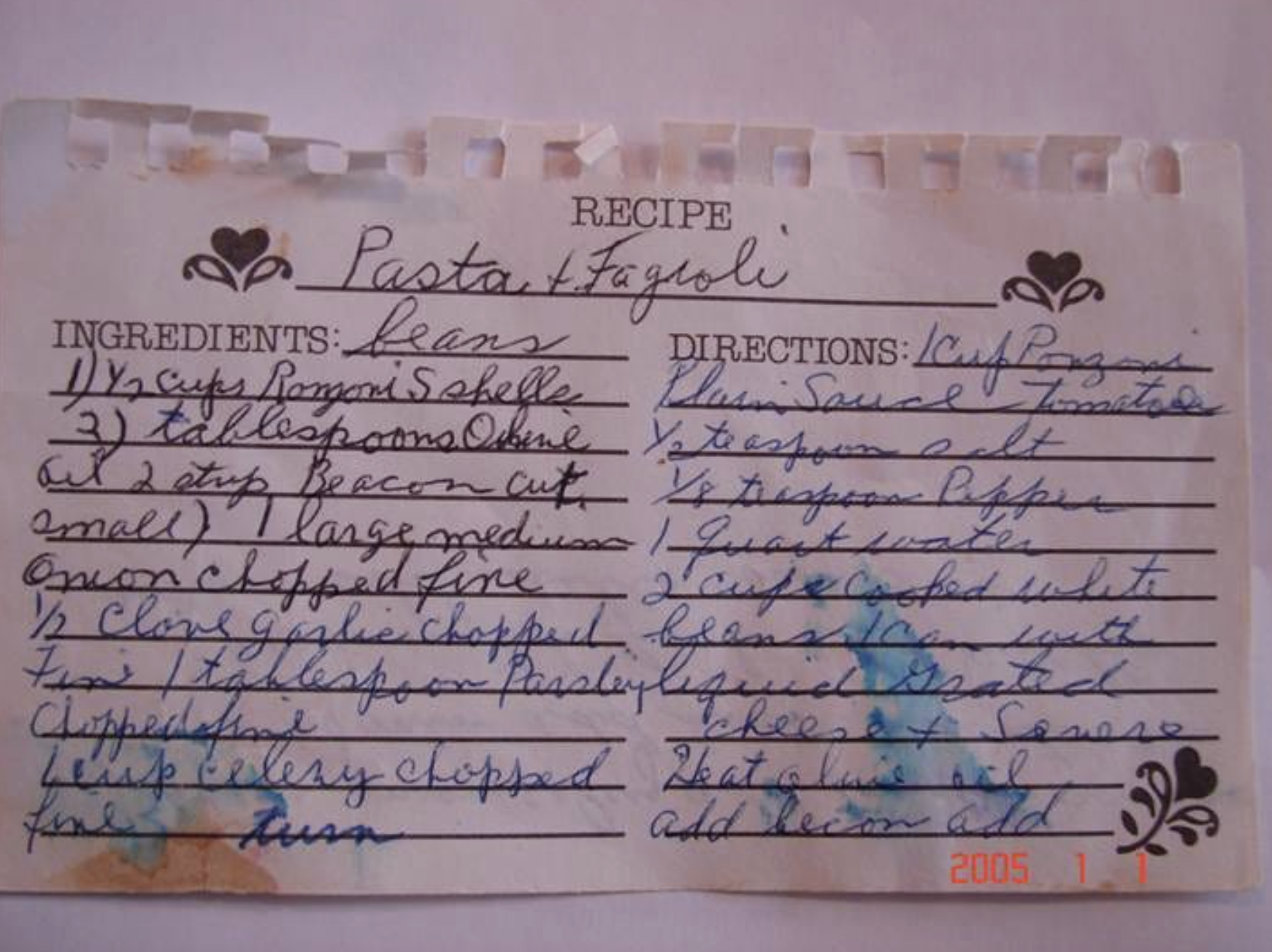 Handwritten Pasta e Fagioli recipe on an aged recipe card, written in cursive by Grandma Jennie, showing ingredients and directions.