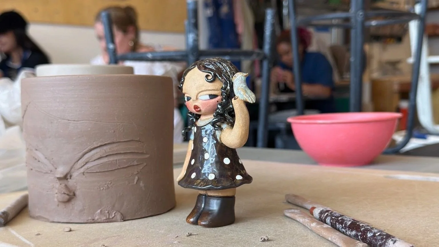 ceramic art piece of a small child