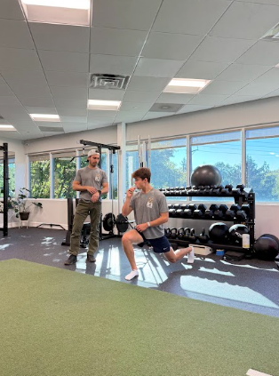 Patient working with a provider at a performance physical therapy clinic in Little Silver, NJ during a strength and conditioning sessio