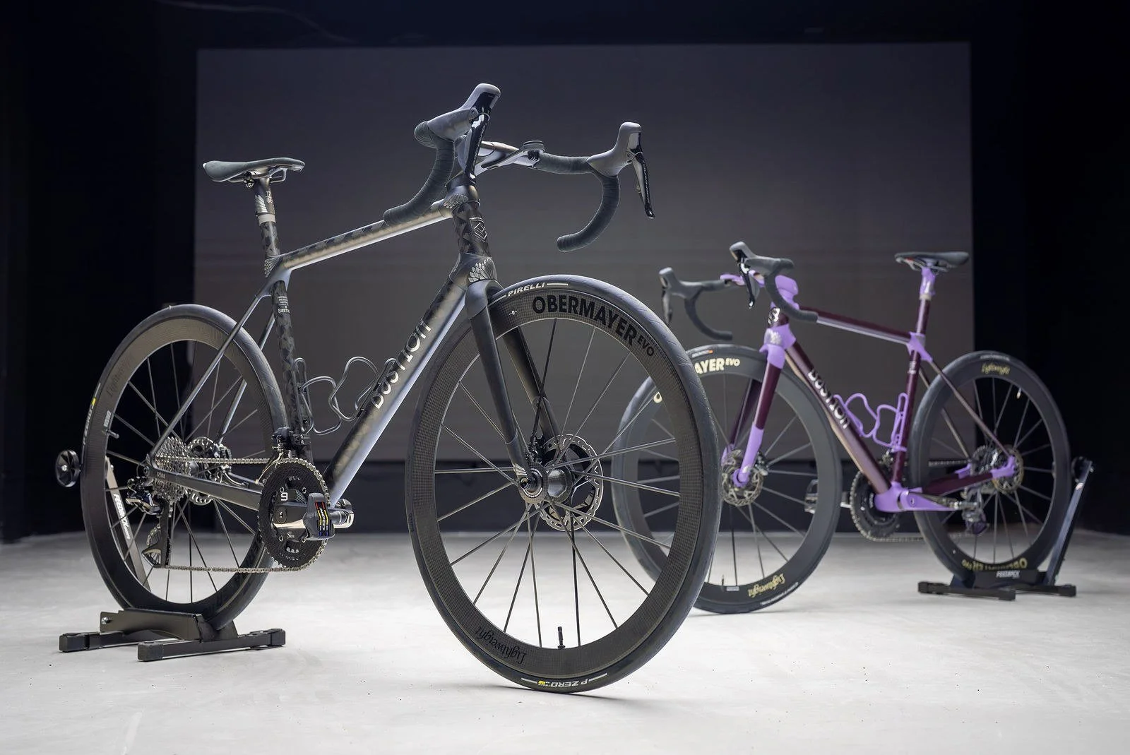 Two bicycles on stands lit on the main floor