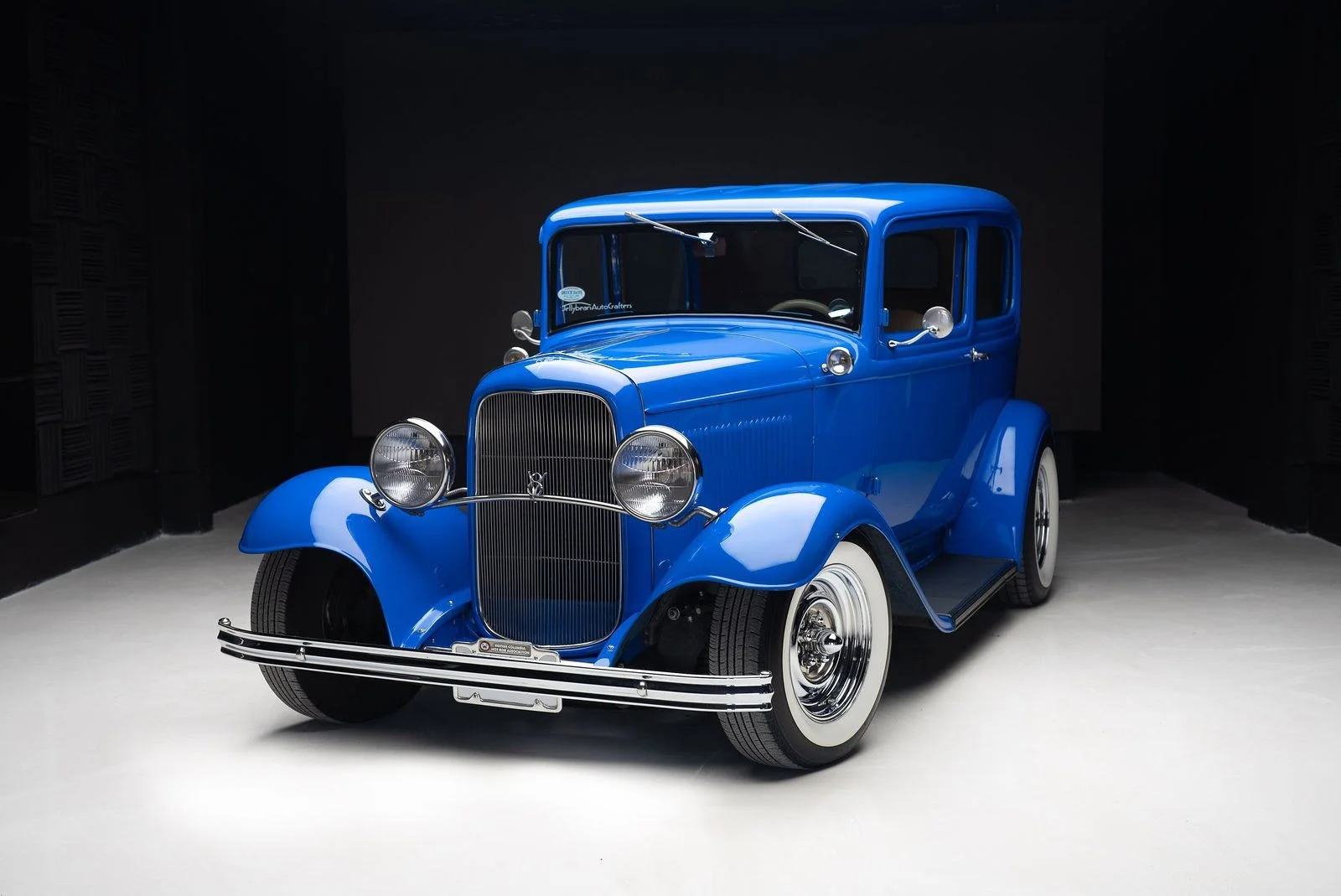 Car under the 15 ft softbox on the gloss white floor at Fist Bump drive in studio, Richmond BC