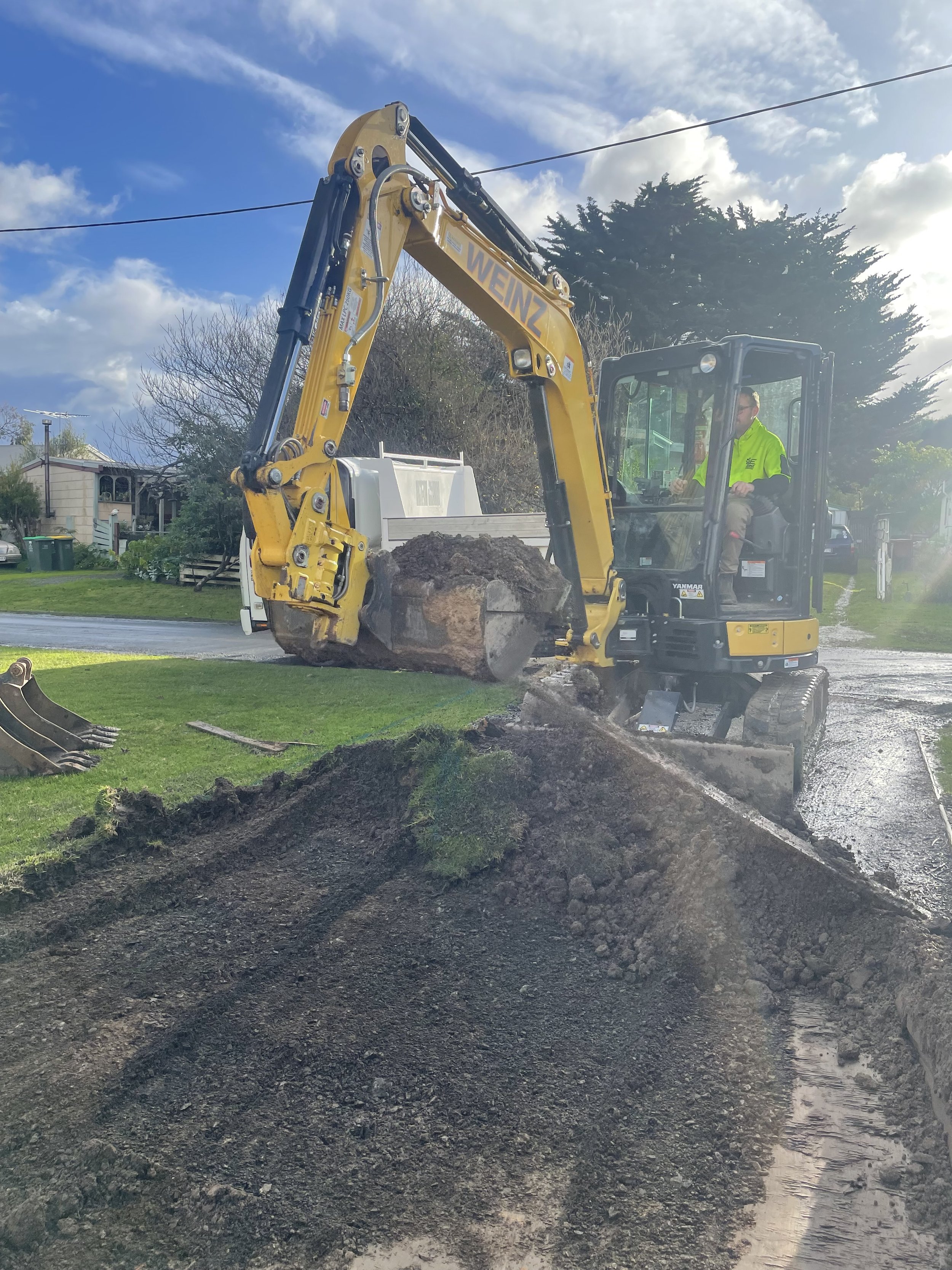 Bulk loading dirt with excavator and truck at Phillip island.
