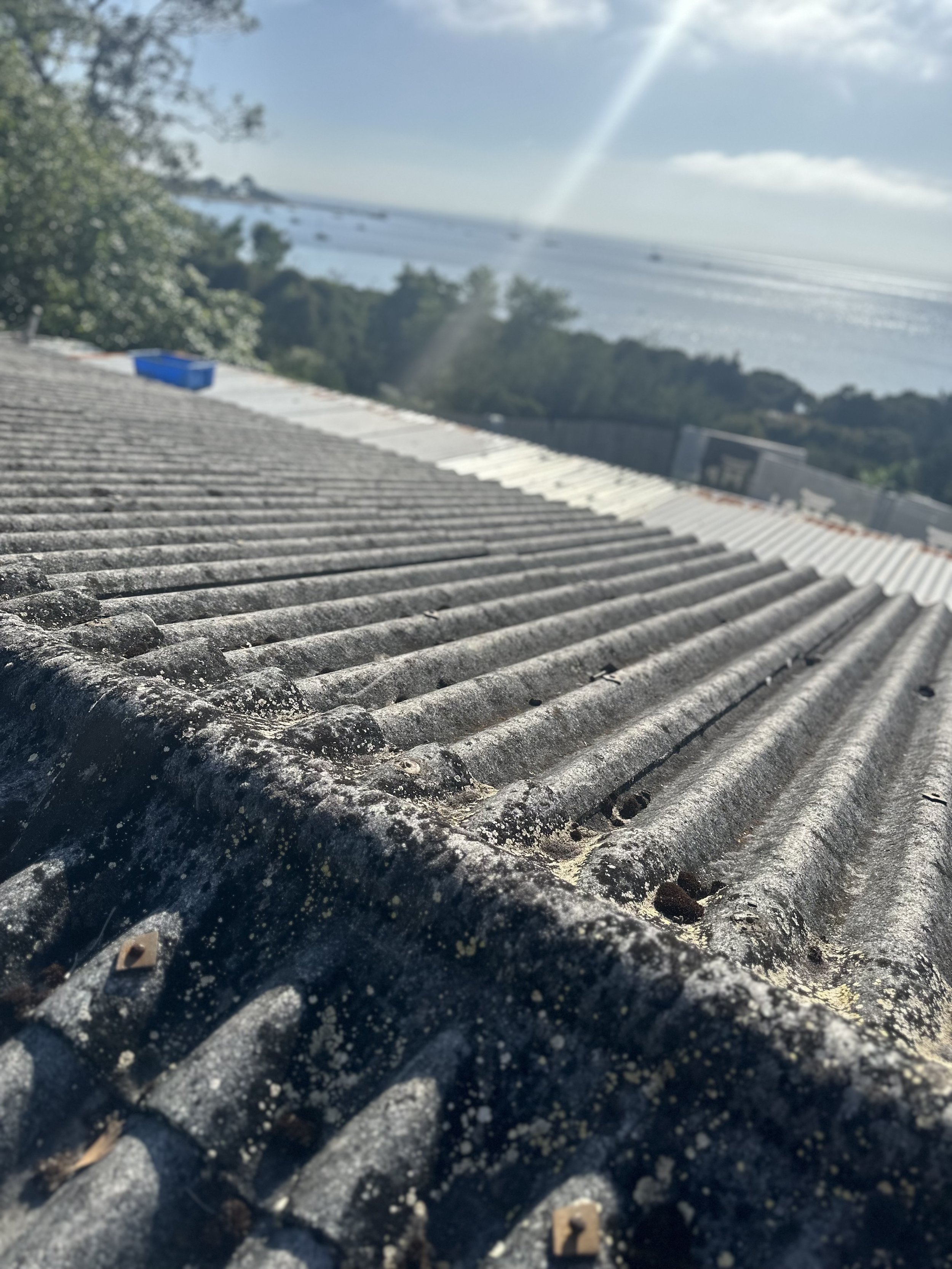 Corrugated roof with sea view in background