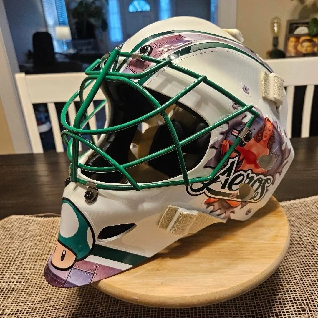Green custom goalie mask decal kit by Shutout Designs - aeros, metal panels, and mushroom