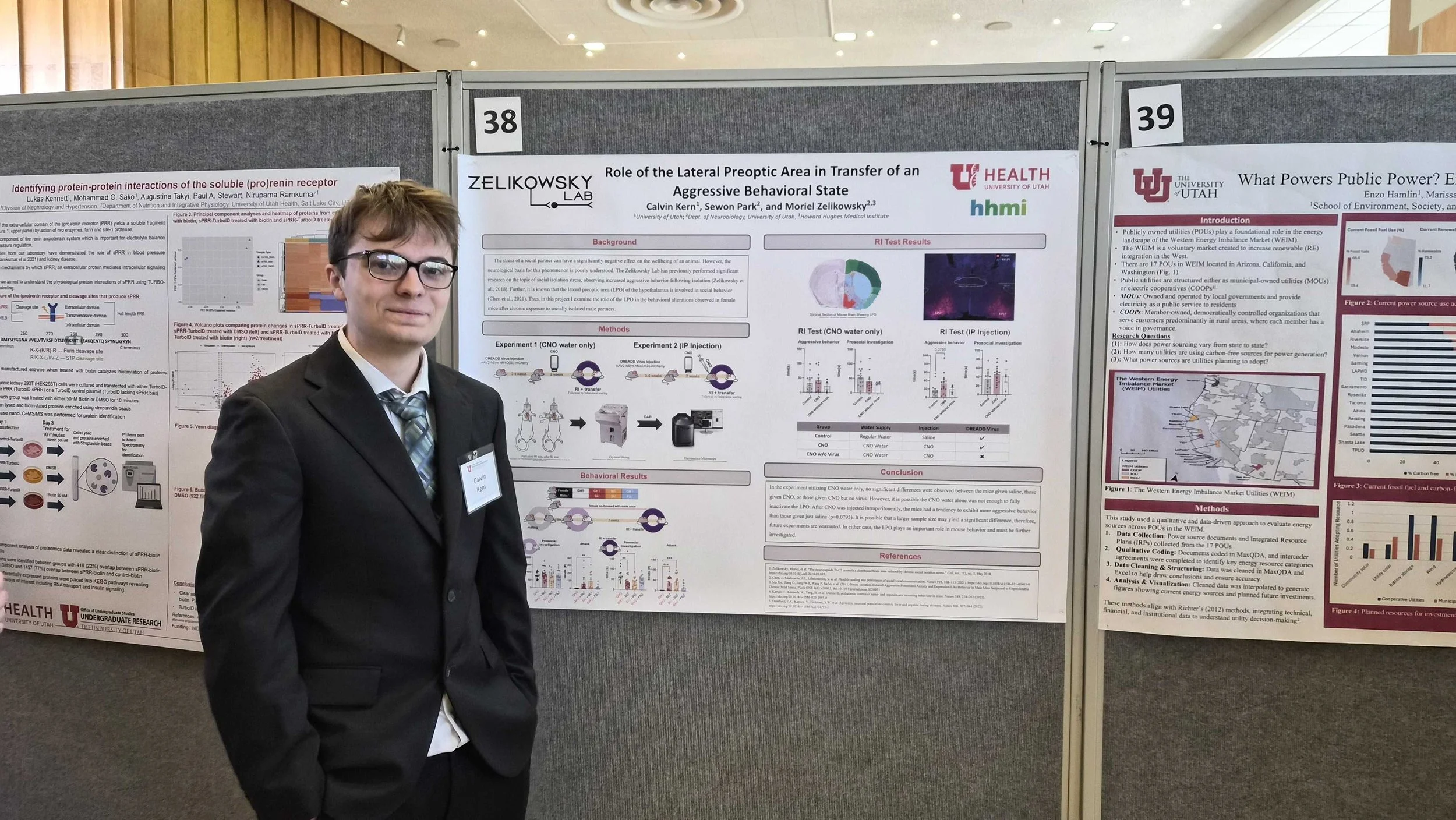 Calvin presenting his poster at the U's Undergraduate Research Conference