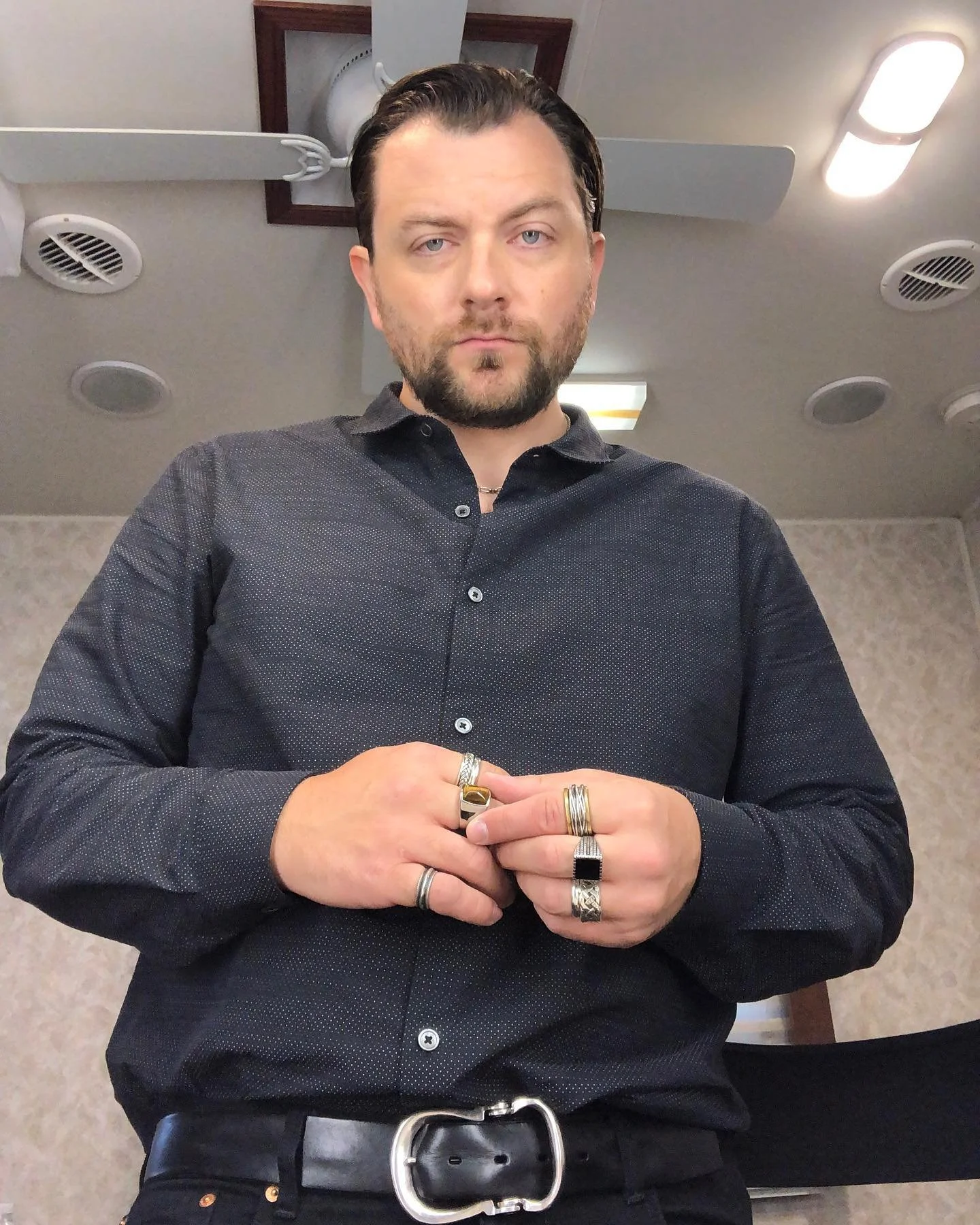 Behind-the-scenes photo of Patrick Murney in his trailer preparing for filming.