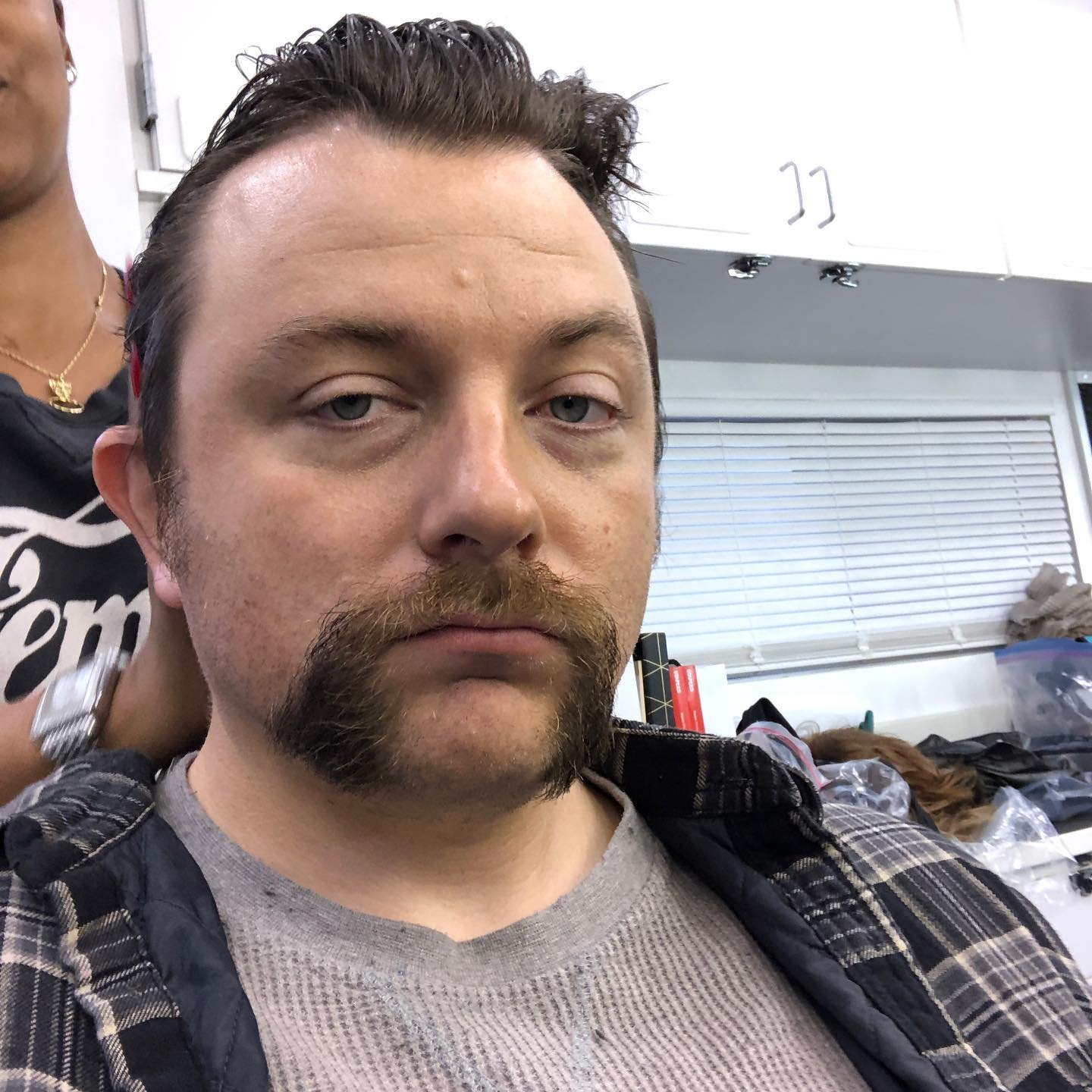 Patrick Murney in hair and makeup behind the scenes on the set of Mare of Easttown.