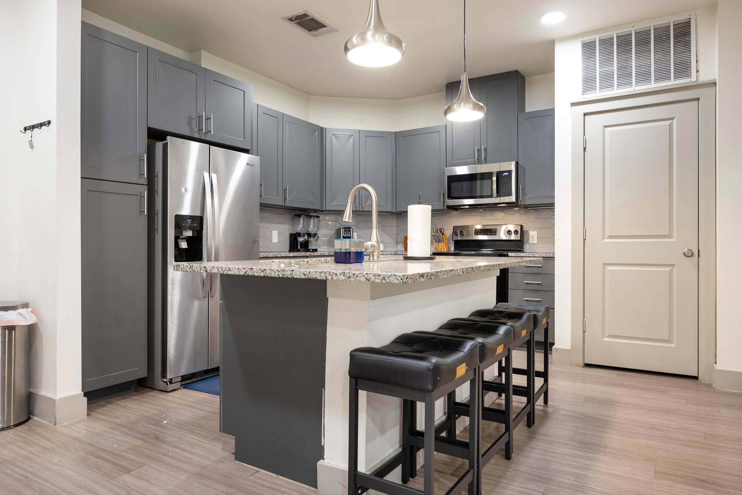 Open-concept Airbnb and Vrbo kitchen with island seating, modern appliances, and functional layout