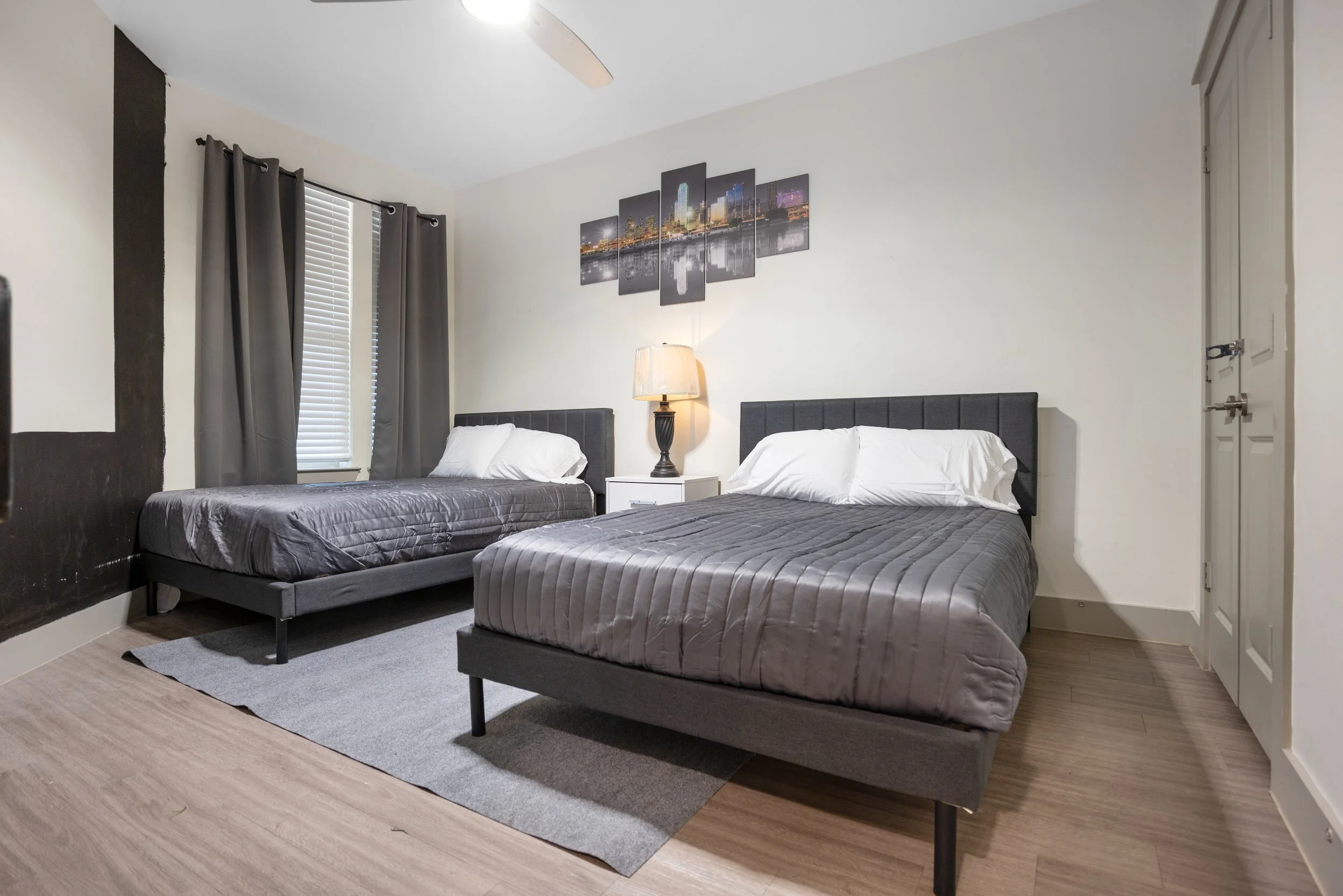 Airbnb and Vrbo bedroom with two beds designed for multiple guests and comfortable accommodations