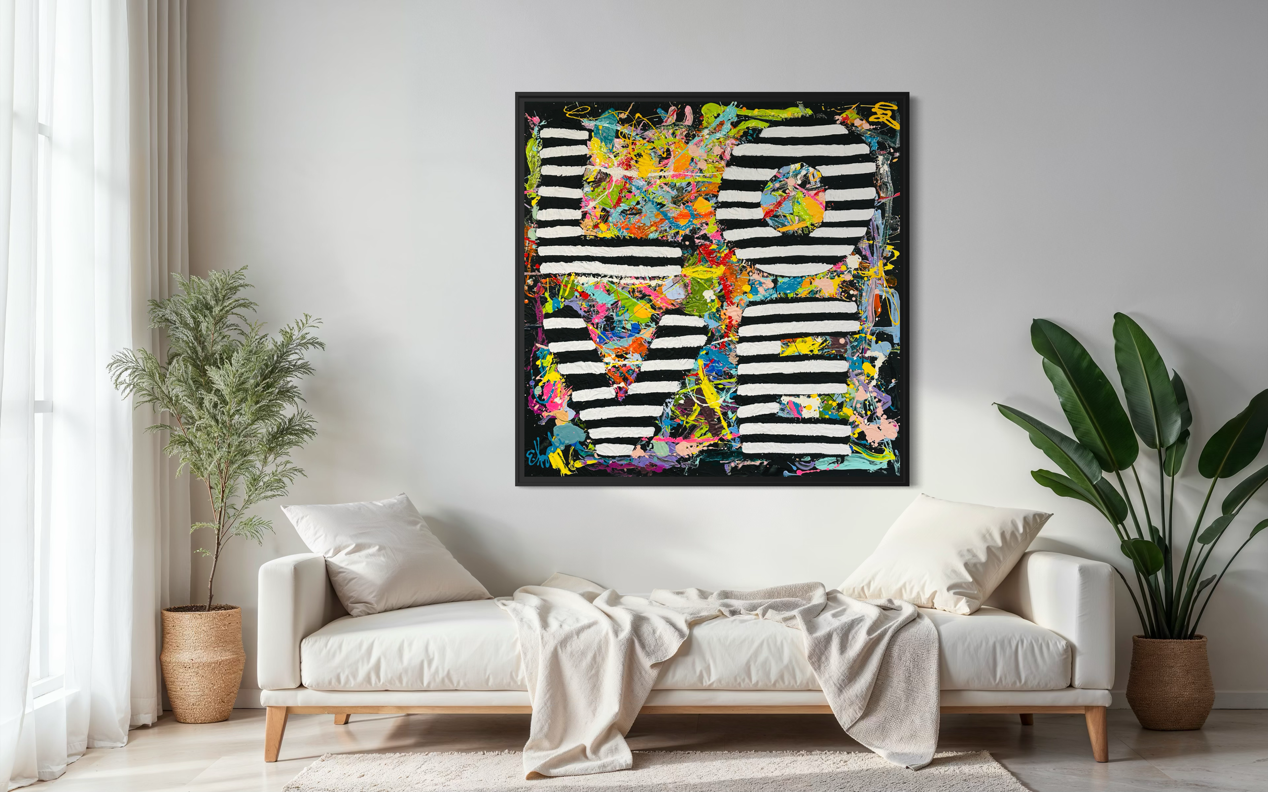 Large colorful abstract painting by Elizabeth Azadi, expressive abstractions style in a modern white bedroom with a beige chaise lounge chair and palm plants