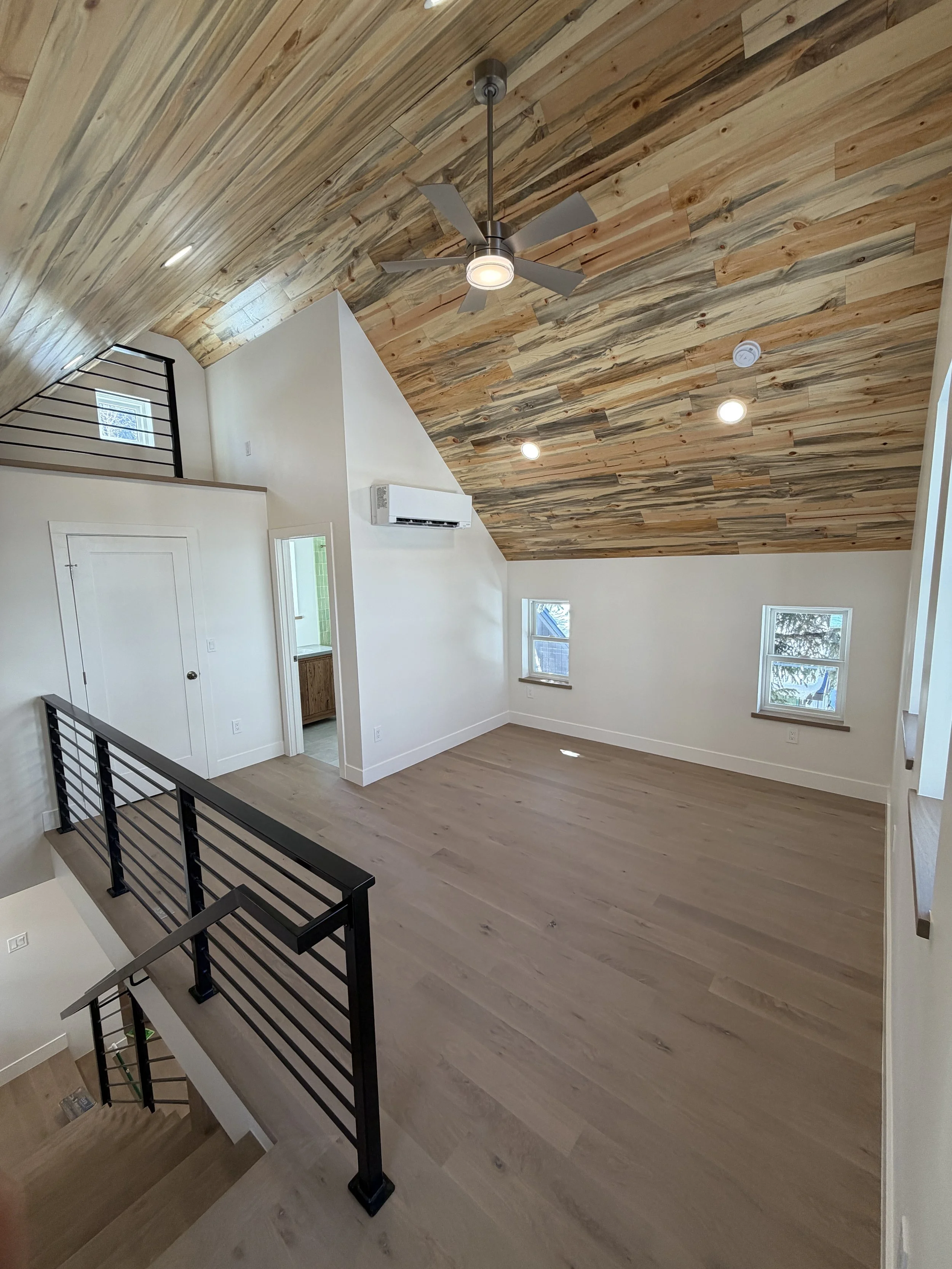 New upper-level bedroom with beetle kill blue stain pine ceiling