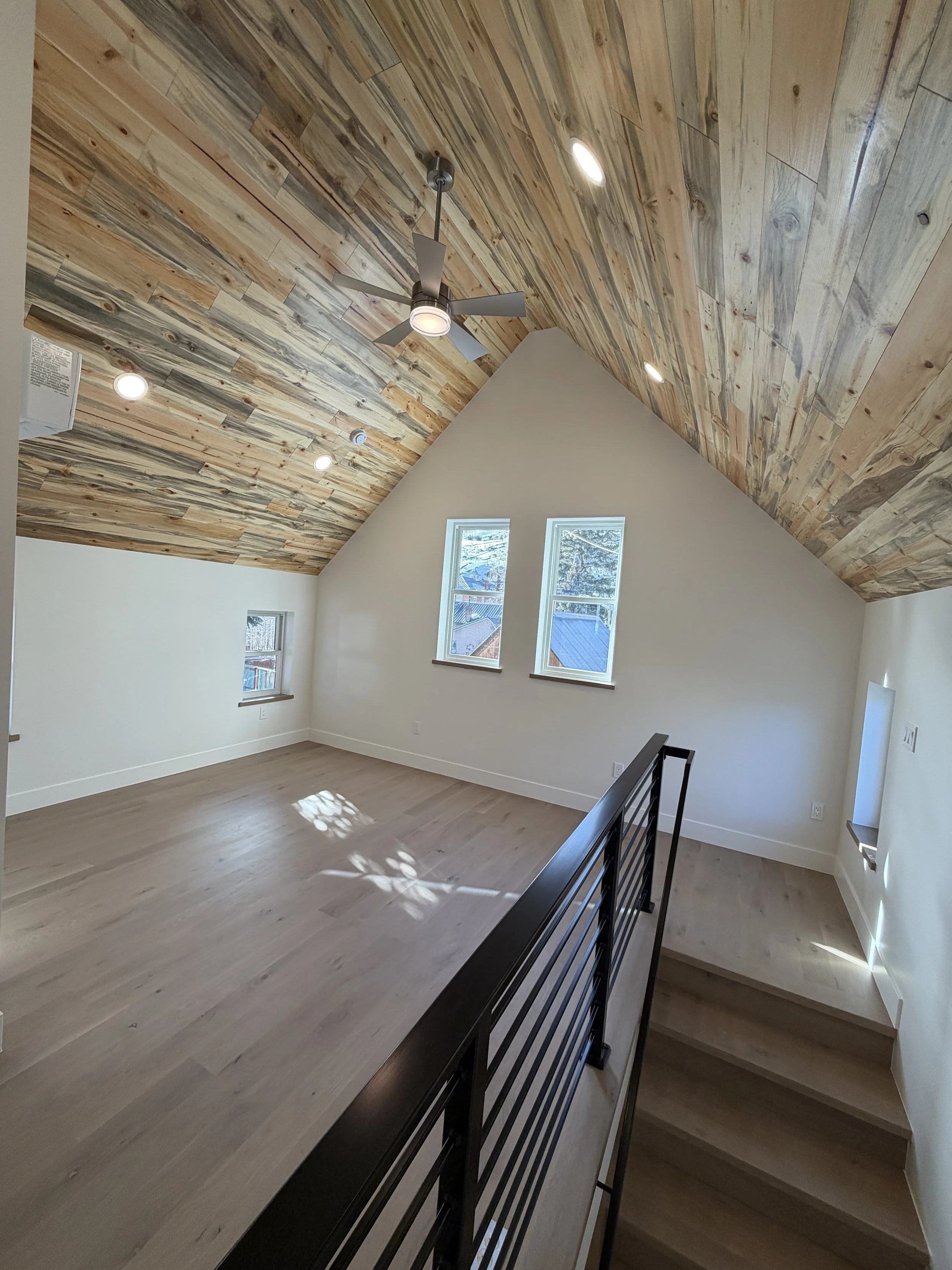 New upper-level bedroom with beetle kill blue stain pine ceiling