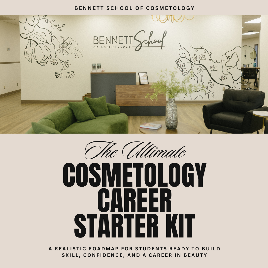 The interior of Bennett School of Cosmetology featuring a reception desk, a green sofa with matching pillows, a black armchair, a large flower arrangement, and decorative wall art with black floral outlines. The wall displays the school's name and a chandelier hangs from the ceiling.