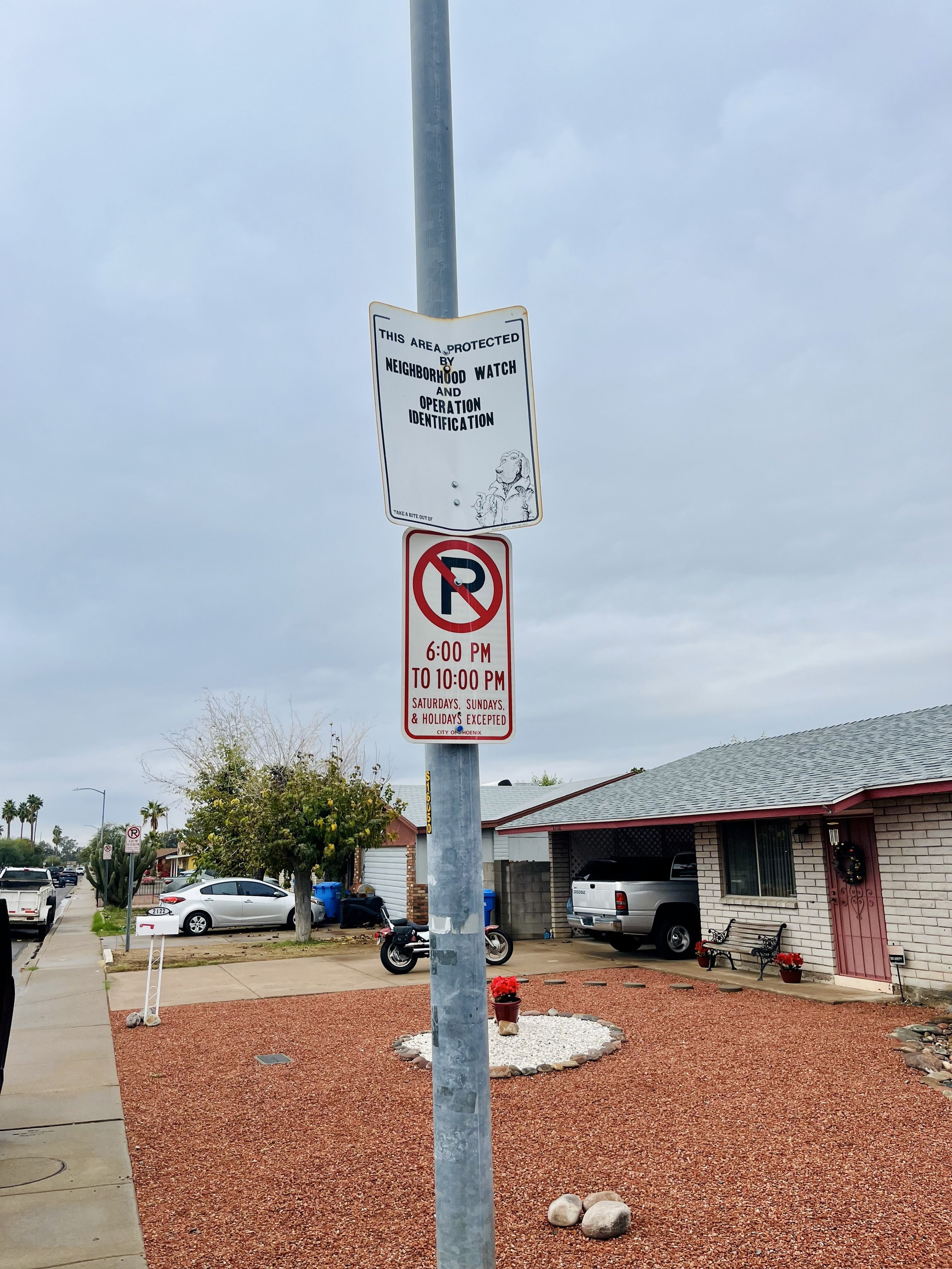 old faded and rusty block watch sign