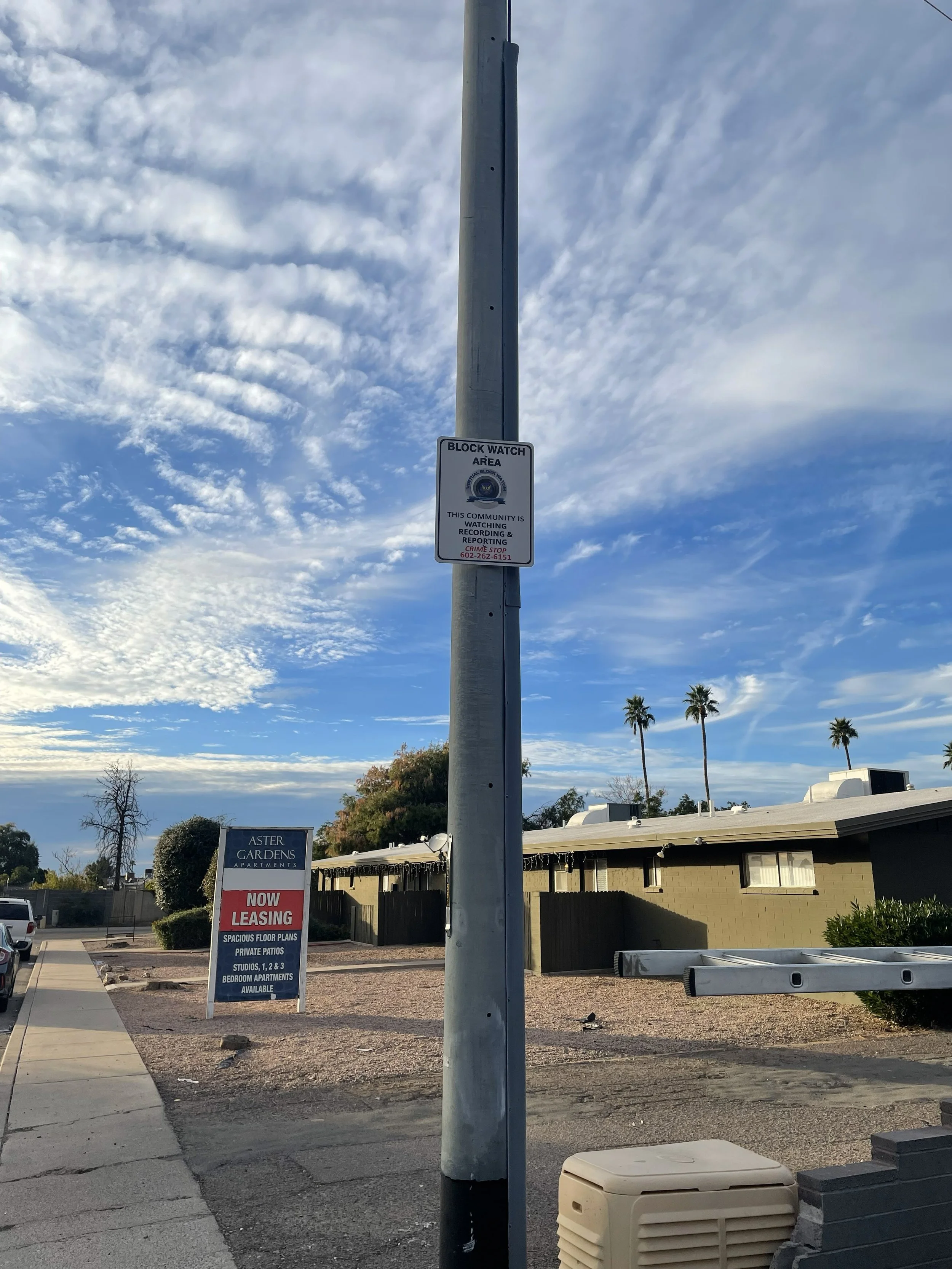 new block watch area sign mounted on pole