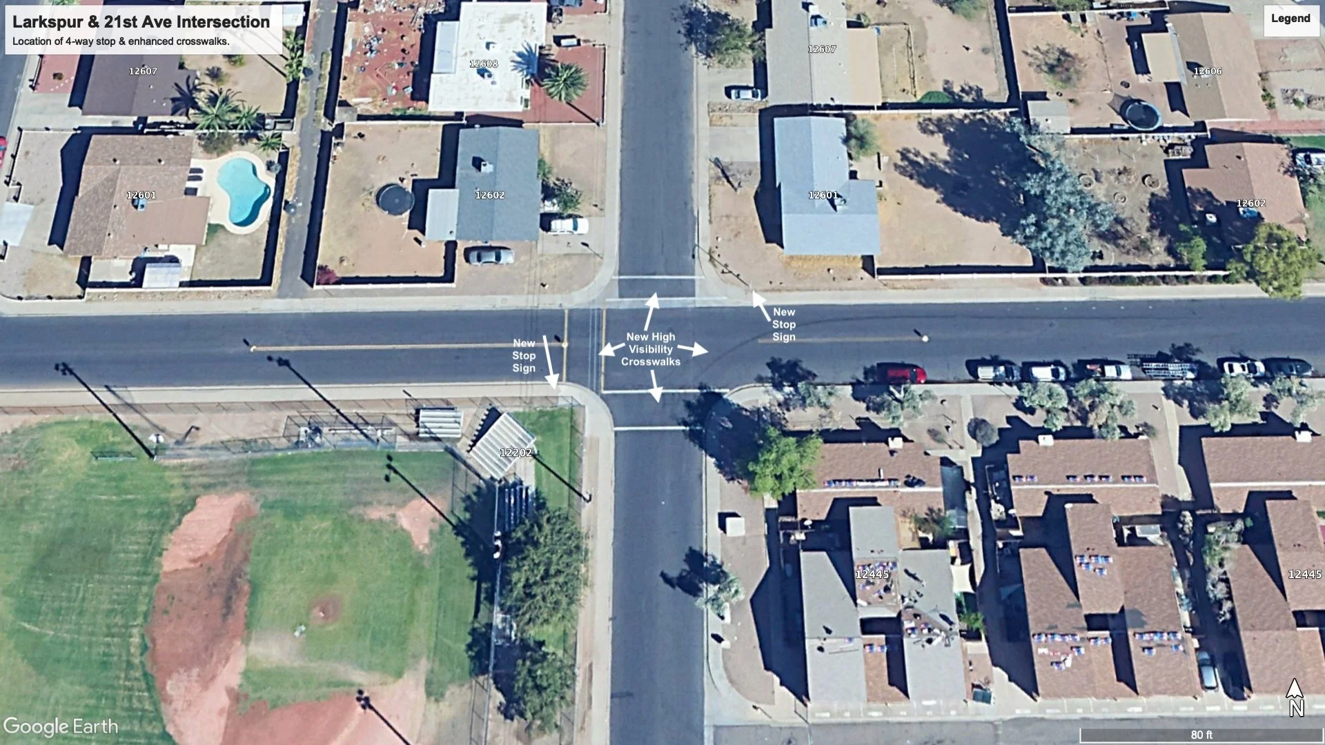 google earth satellite view of intersection at 21st Ave and Larkspur Drive with arrows indicating new 4-way stop and high visibility crosswalk locations