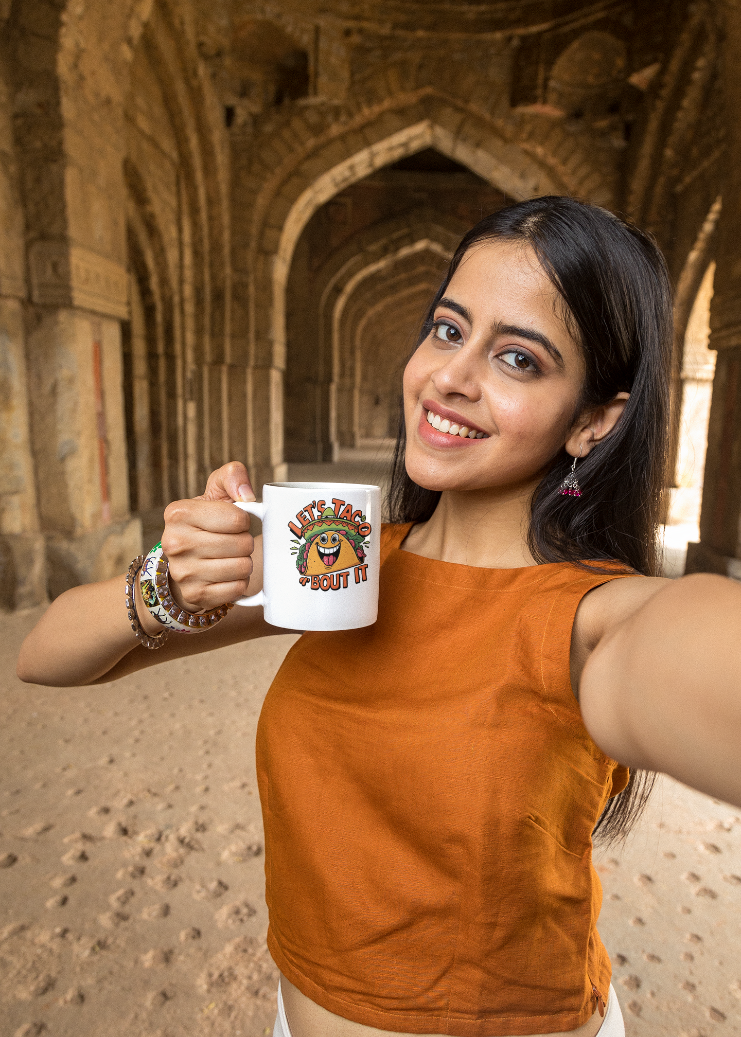 11-oz-coffee-mug-mockup-of-a-smiling-woman-taking-a-selfie-in-a-temple-m25874.png