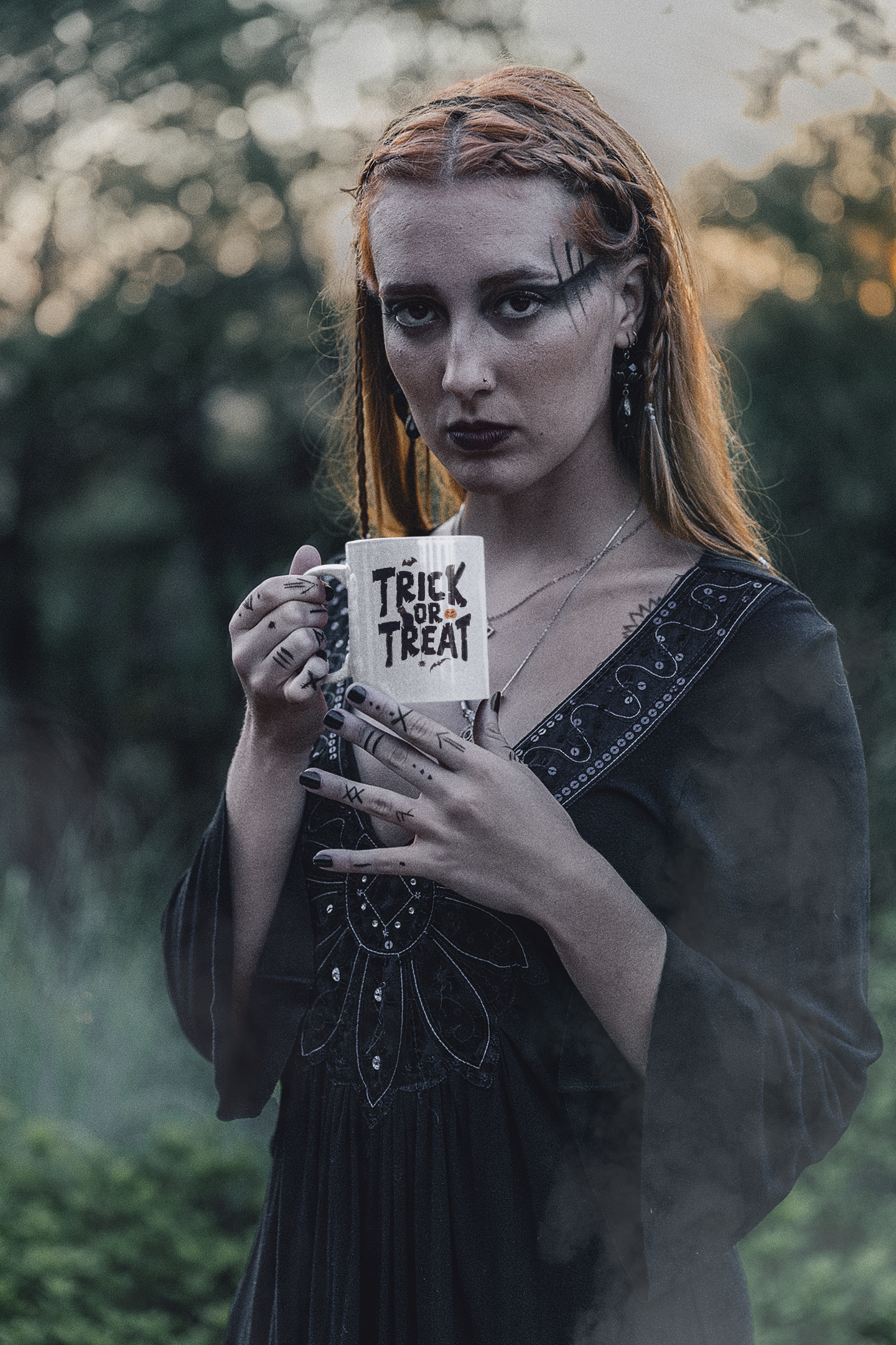 mockup-of-a-woman-with-dark-forest-inspired-makeup-holding-an-11-oz-mug-m29734.png