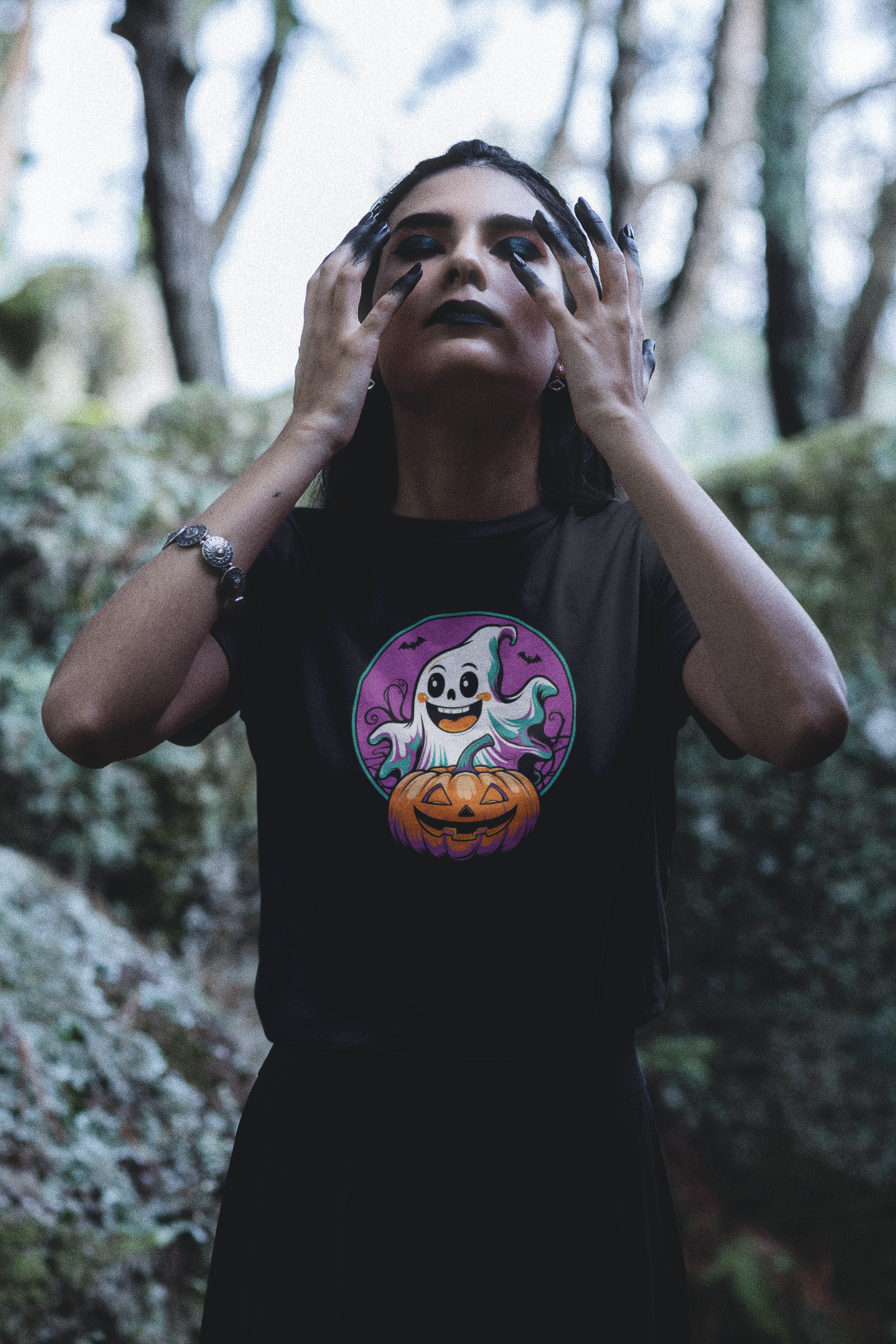 bella-canvas-t-shirt-featuring-a-woman-with-dark-eye-makeup-posing-in-a-wicca-setting-m29712.png