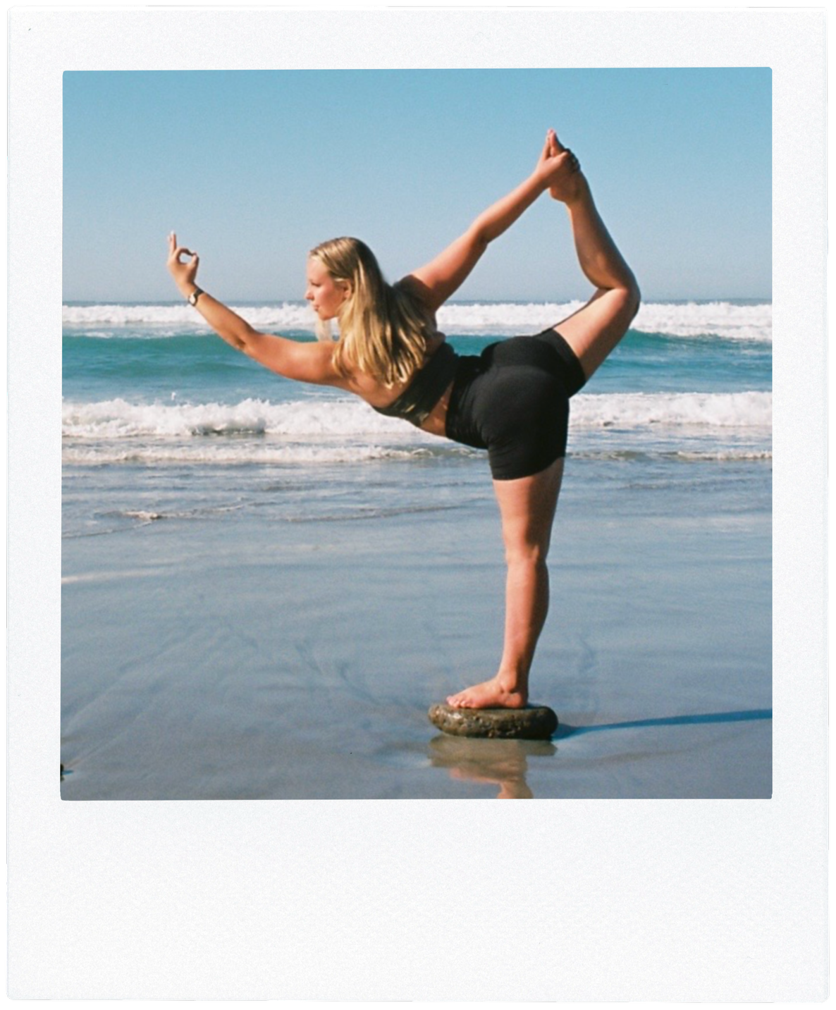 35mm film photo of Sarah Madore in Standing Bow Pose, or Dandayamana Dhanurasana, on the beach. Framed with a white border that resembles an instant film photo. Link to "Yoga" webpage.