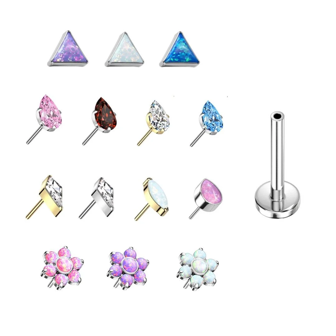 Set of colorful gemstone and opal jewelry nose studs in various shapes including triangles, teardrops, rectangles, and flower clusters, displayed on a white background.