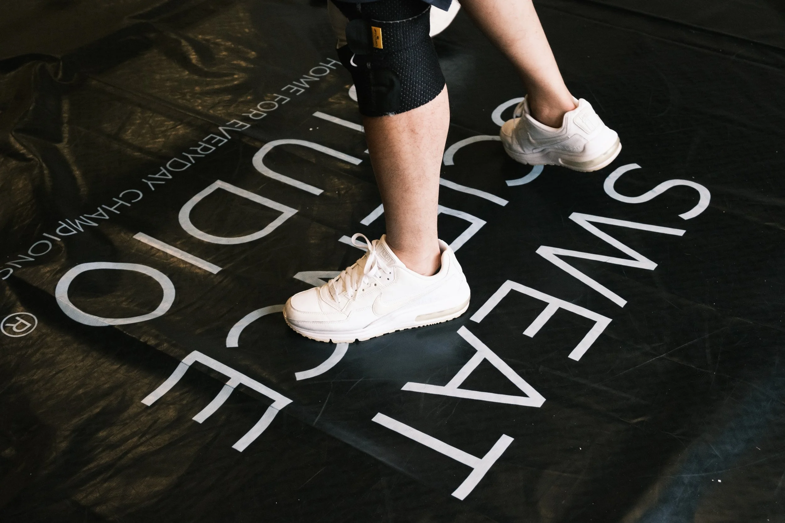 Close-up of a boxer standing on the Sweat Science Studio branded gym mat, Clarke Quay Singapore