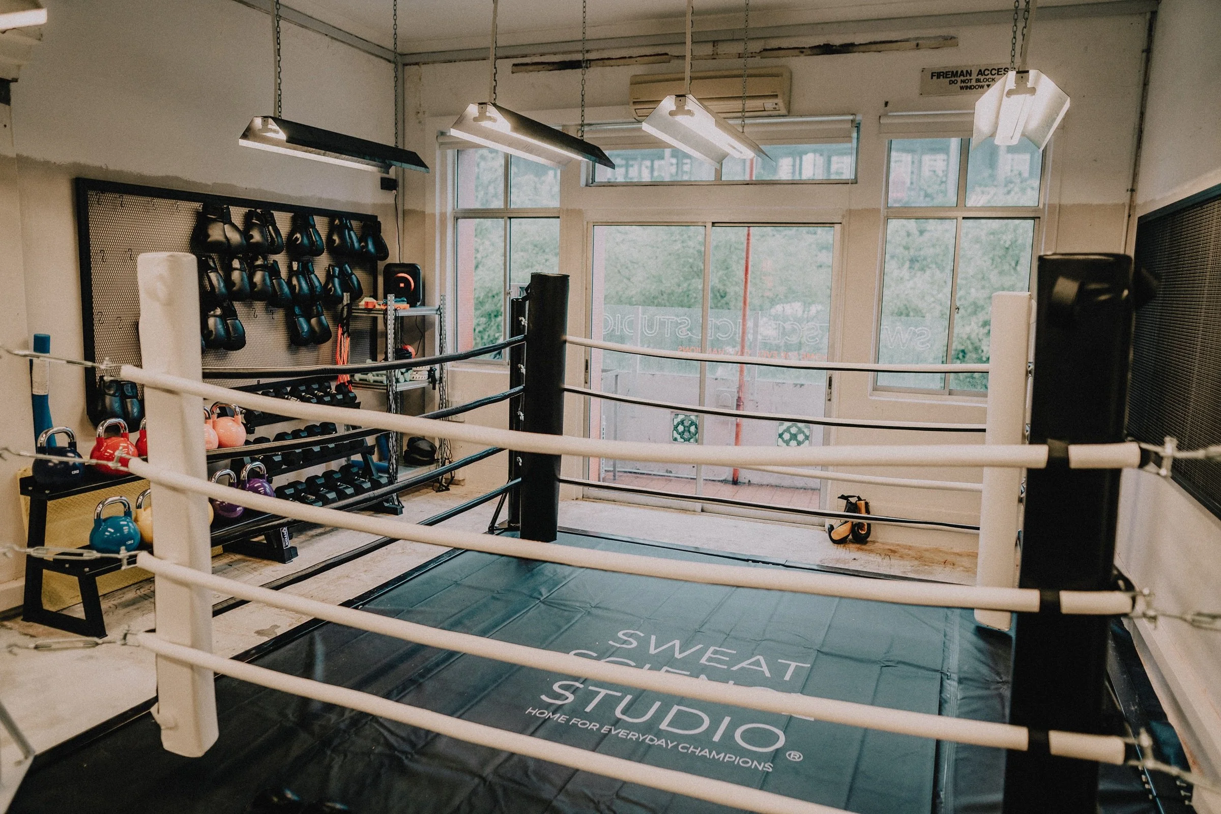 Boxing ring and training equipment at Sweat Science Studio boutique boxing gym in Clarke Quay, Singapore
