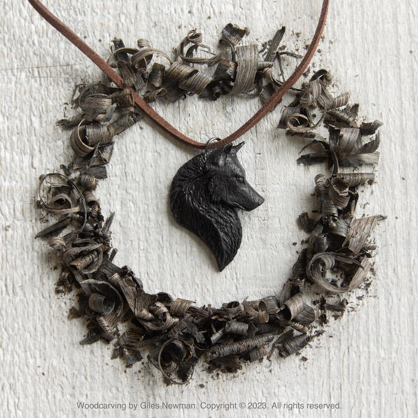 Sometimes, when my darkness outlives the night, I meet my friend, my foe, and I follow, not knowing whether he will to lead me out, toward the light or deeper and deeper into an endless night.

Abonos Oak Wolf pendant. Carved in partially fossilised 