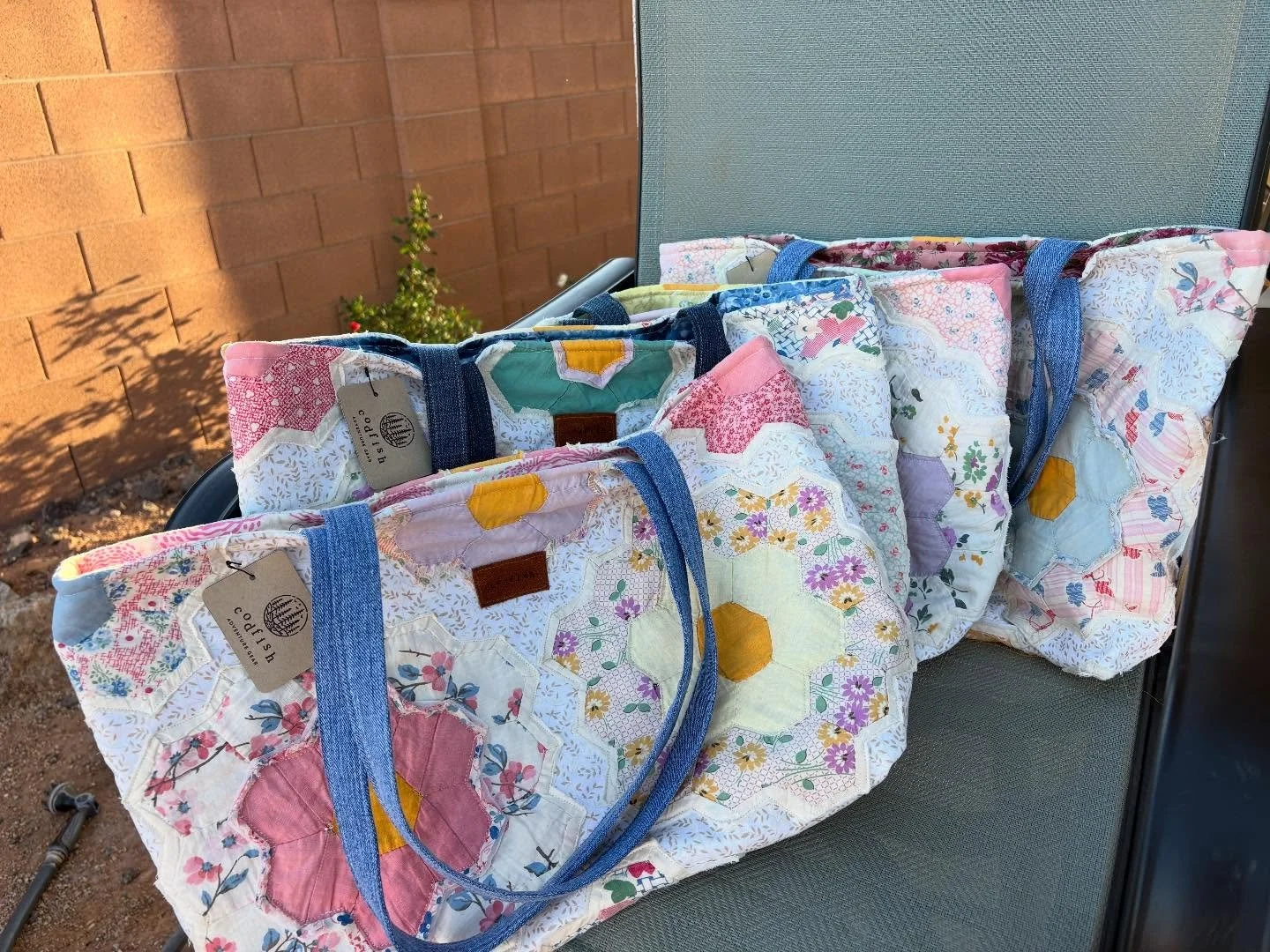 These tote bags were made from my client&rsquo;s grandmother&rsquo;s quilt.  It was pretty worn out but I gently saved the best pieces and turned them into beautiful bags.  I&rsquo;m sure they&rsquo;re proud to show off their grandmother&rsquo;s prid