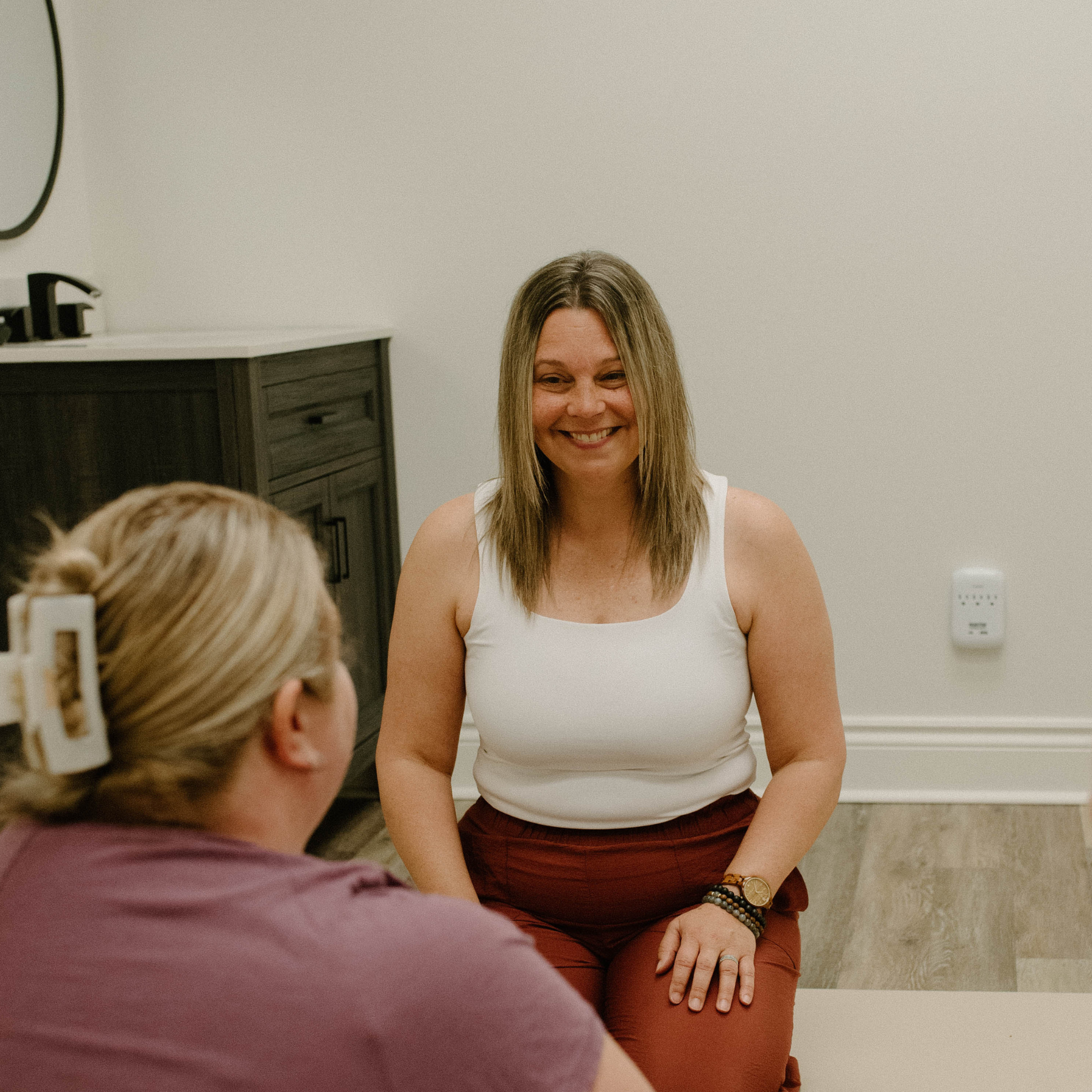 CEO Melissa with Mama client in session smiling.