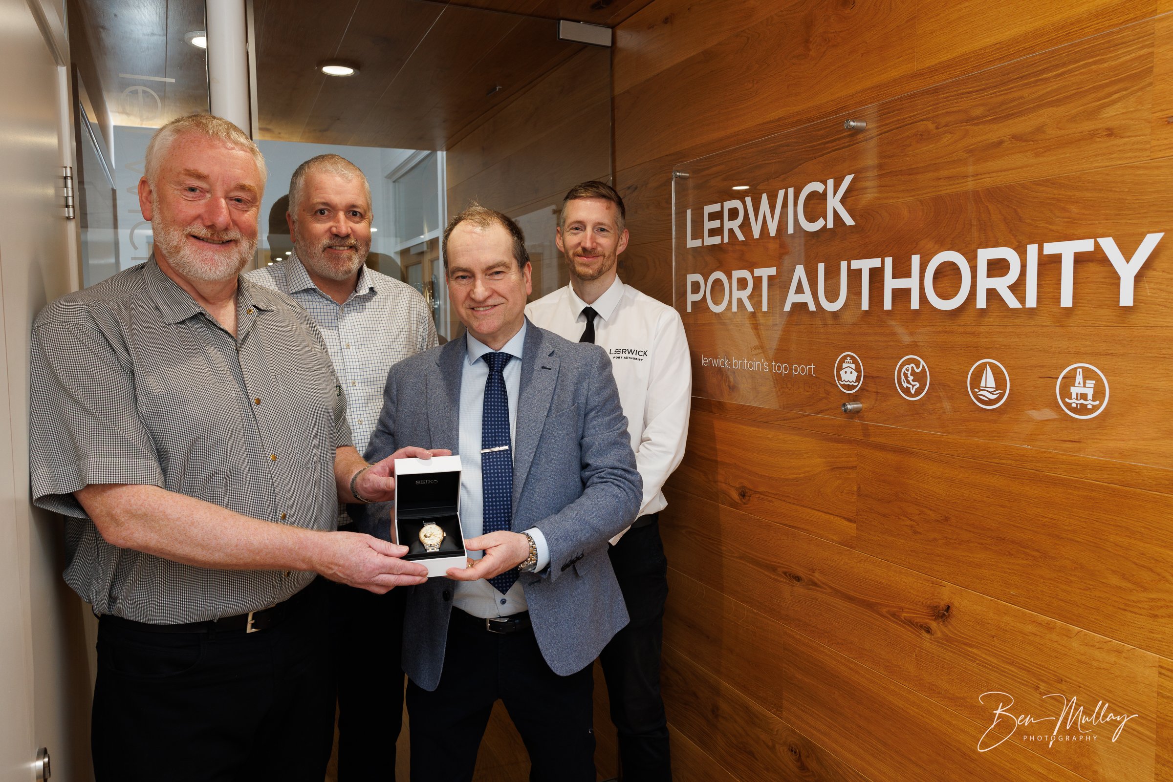Portrait of Charles Smith marking 40 years of service with Lerwick Port Authority.