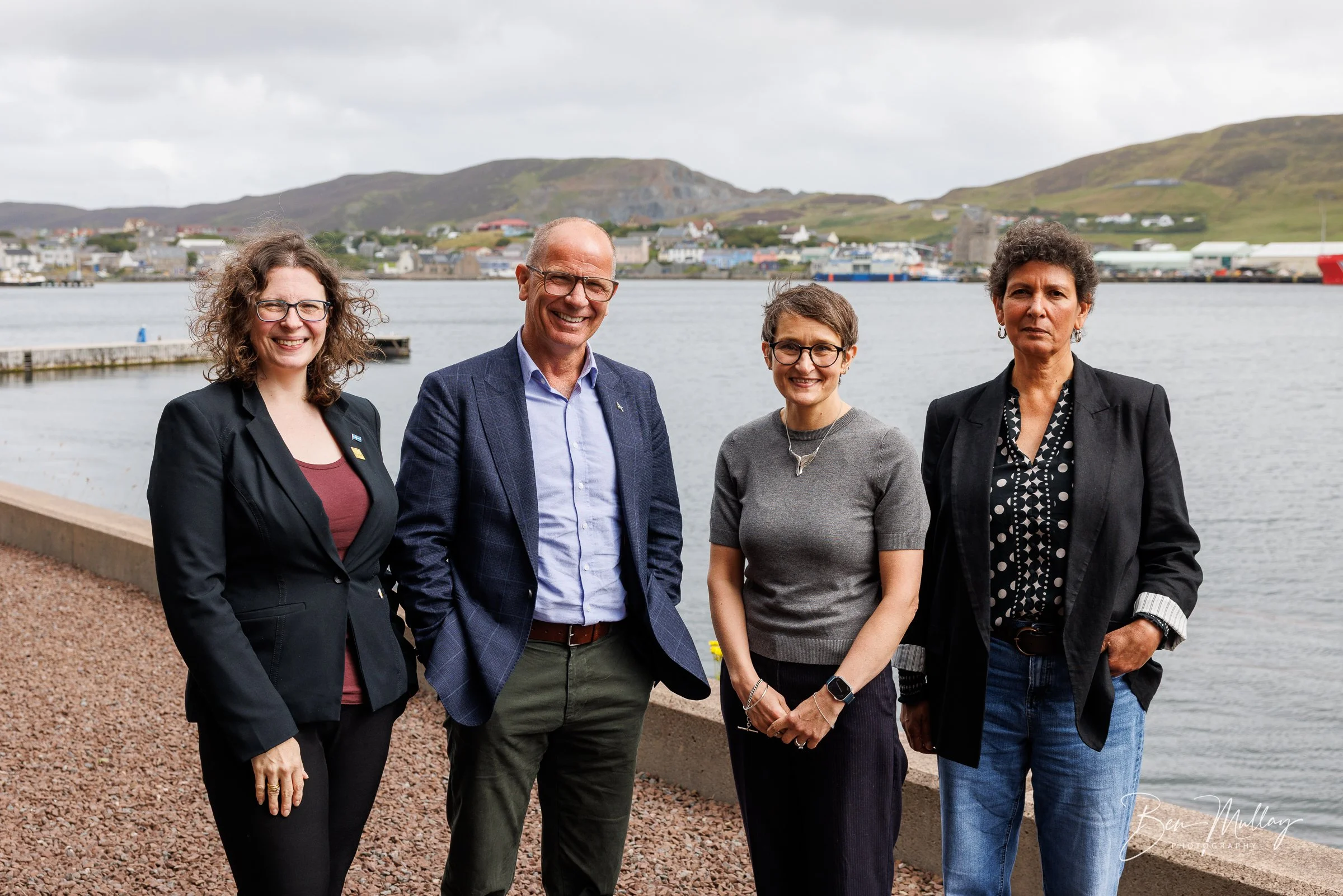 Group photograph outside UHI Shetland's Scalloway campus during a ministerial visit focused on sustainable seafood innovation.