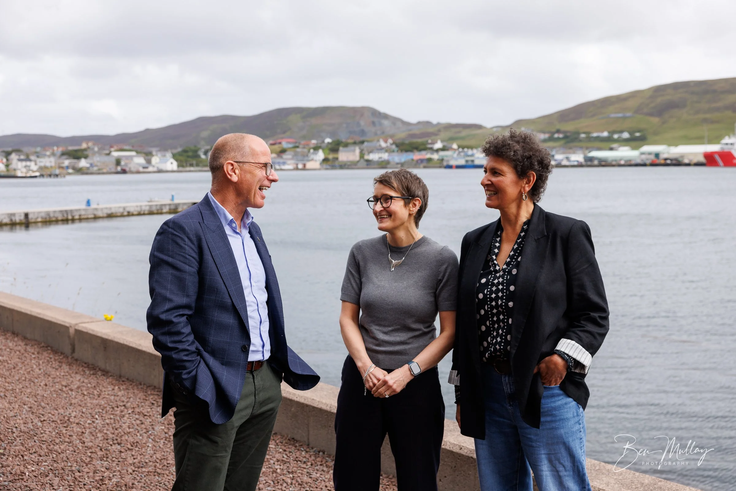 Group photograph outside UHI Shetland's Scalloway campus during a ministerial visit focused on sustainable seafood innovation.