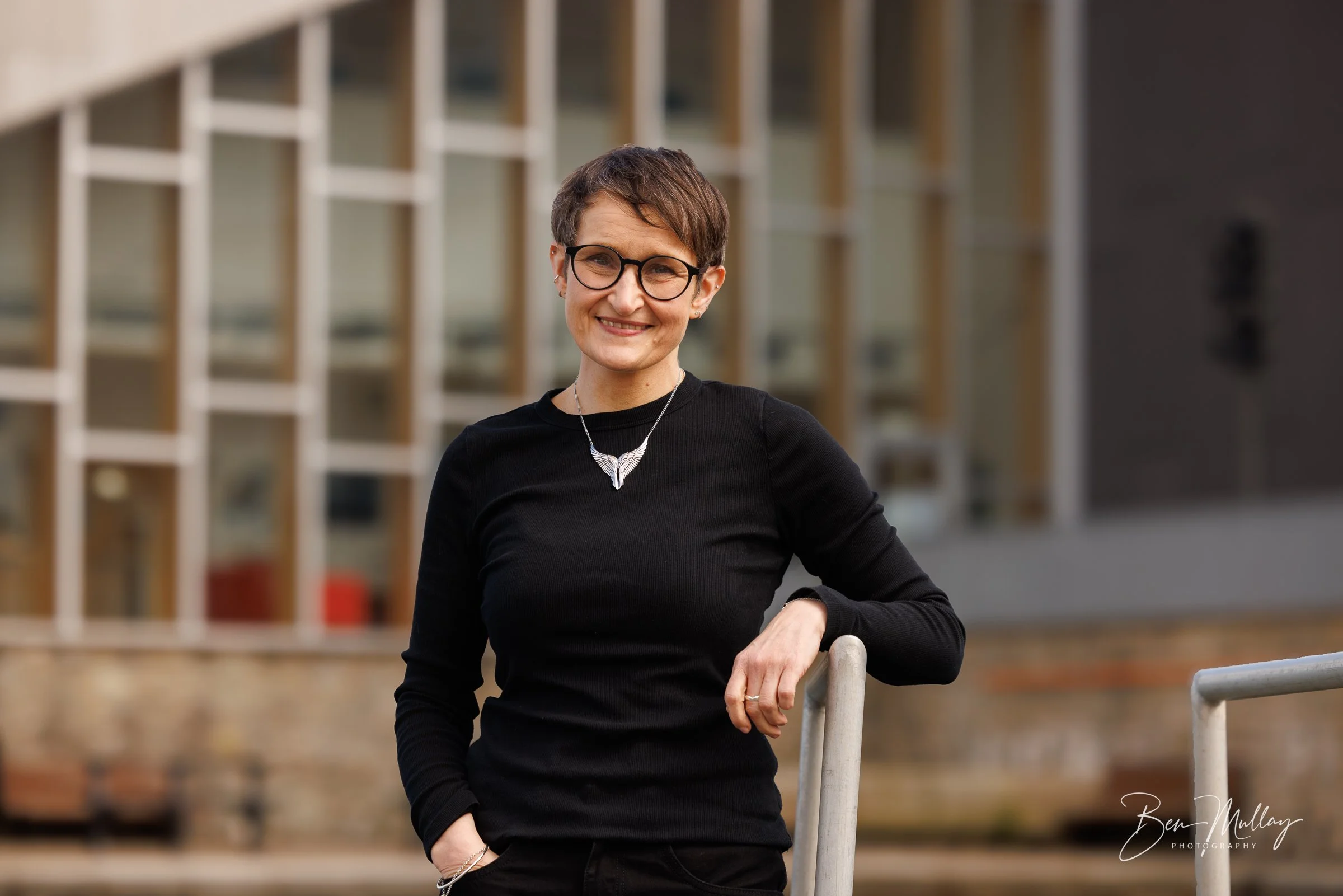 Dr Beth Mouat in a professional headshot.
