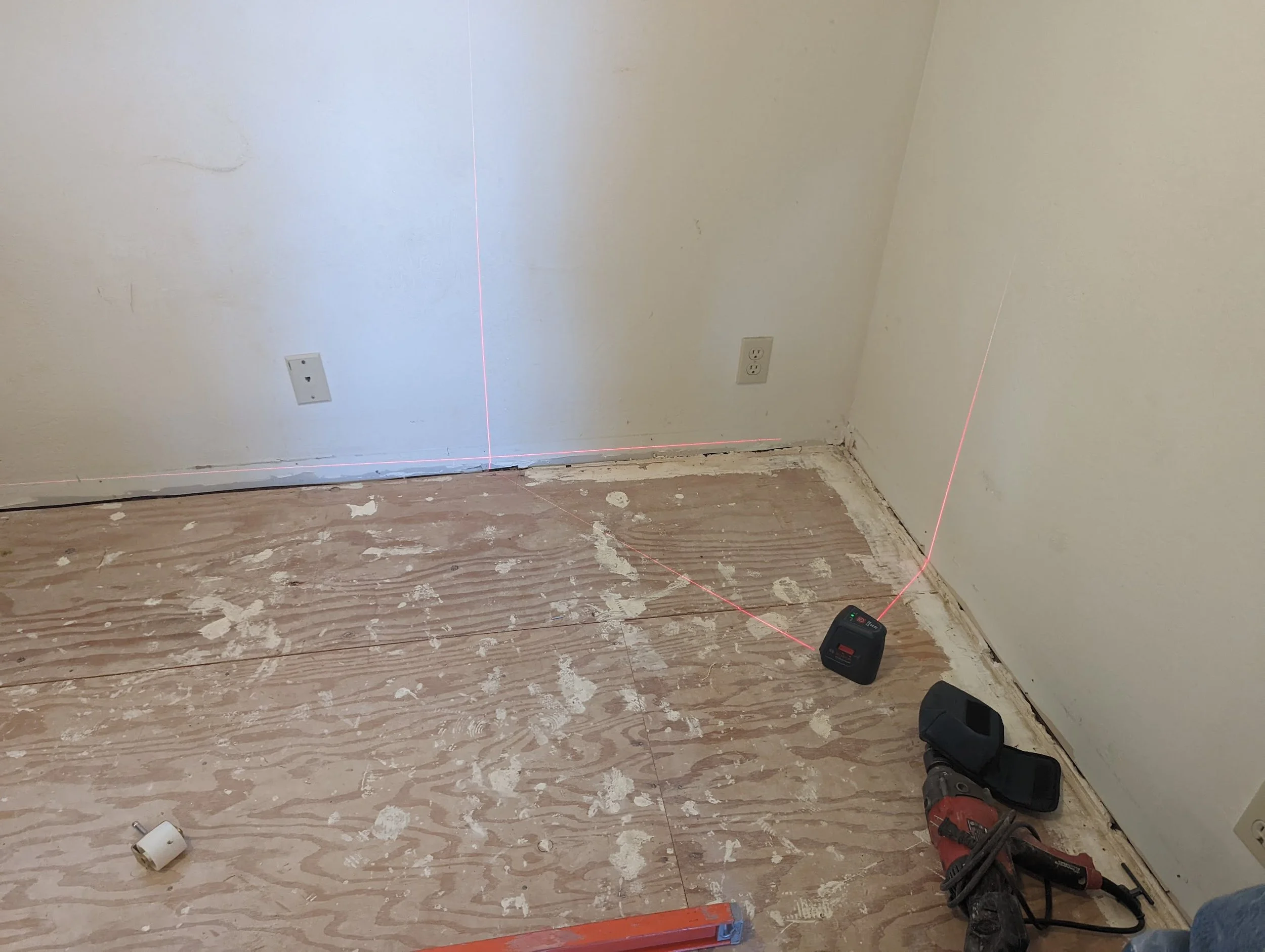 Prepping for floor installation and painting the walls.