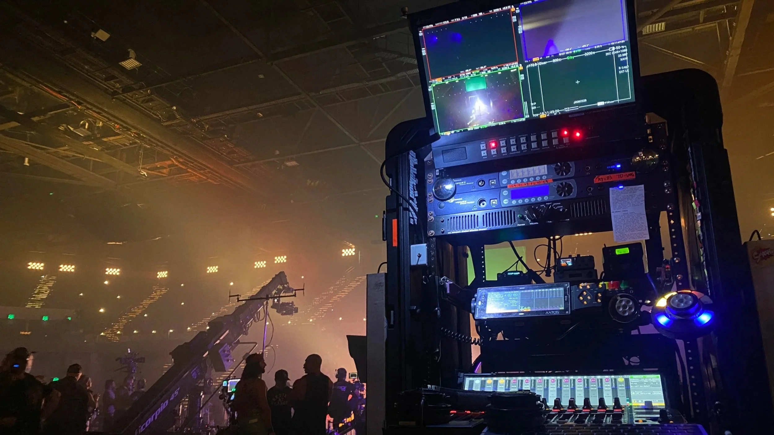 Location sound recording equipment setup in a large arena during a live production