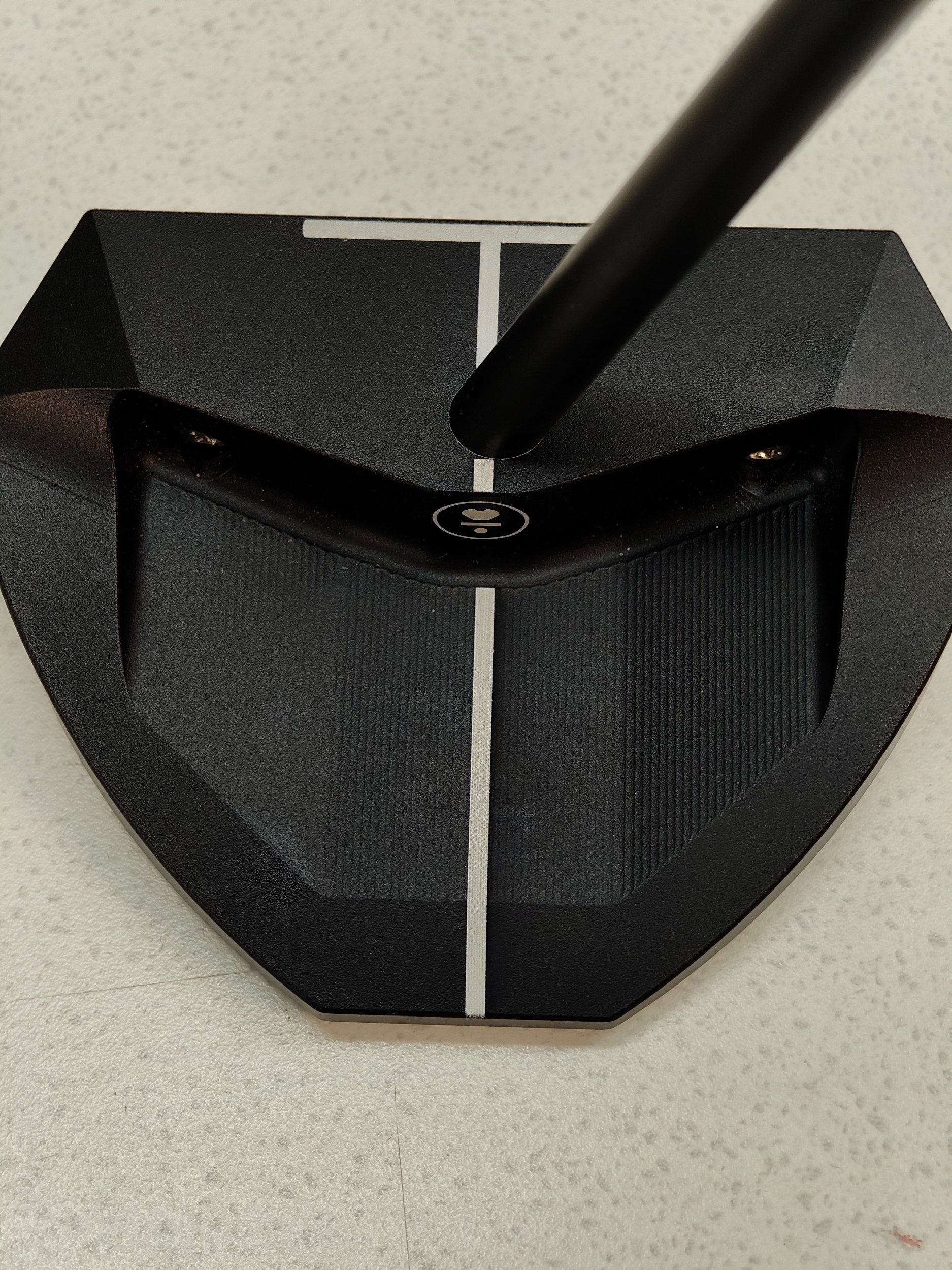 white alignment line laser engraved onto black putter
