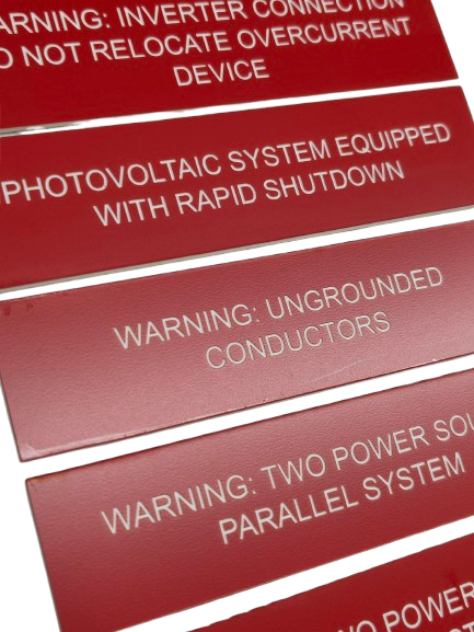 Red Lamacoid label with electrical text
