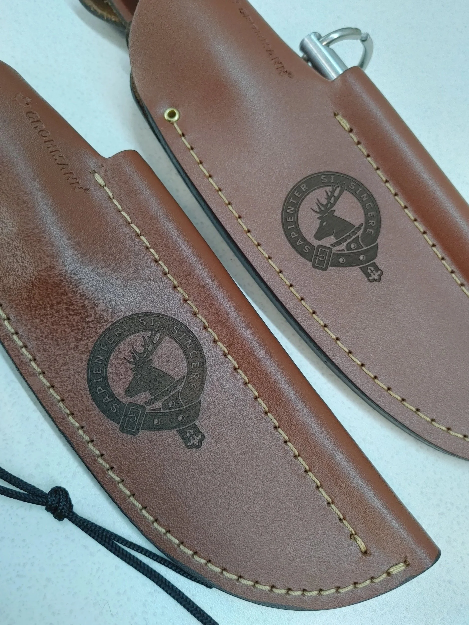 Leather knife scabbard laser engraved with a crest image