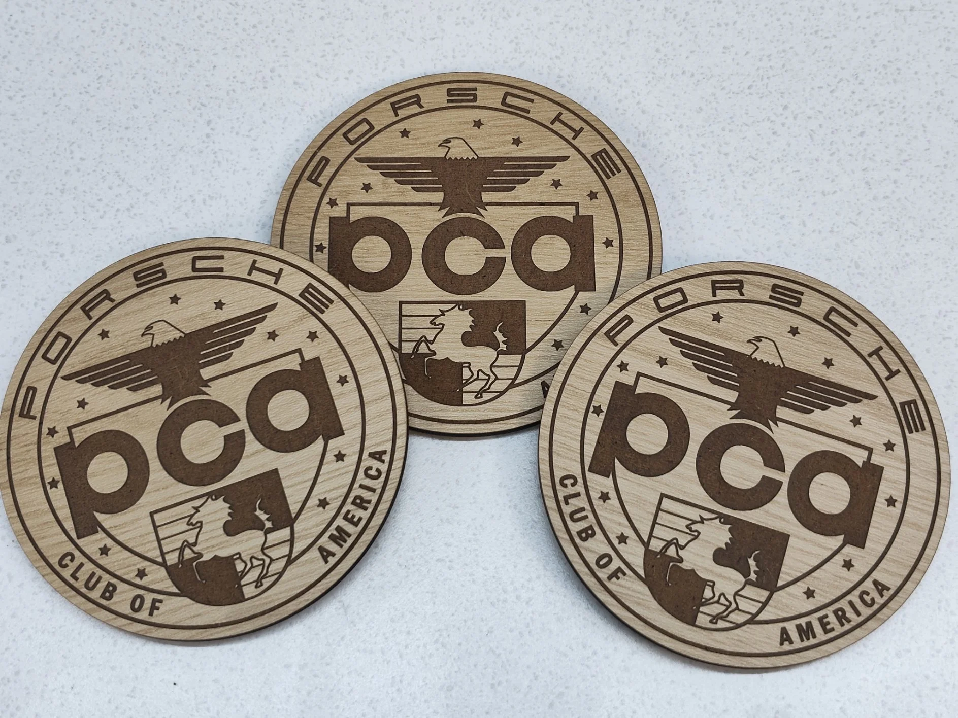Laser cut and engraved TruFlat coasters with full cork backing.