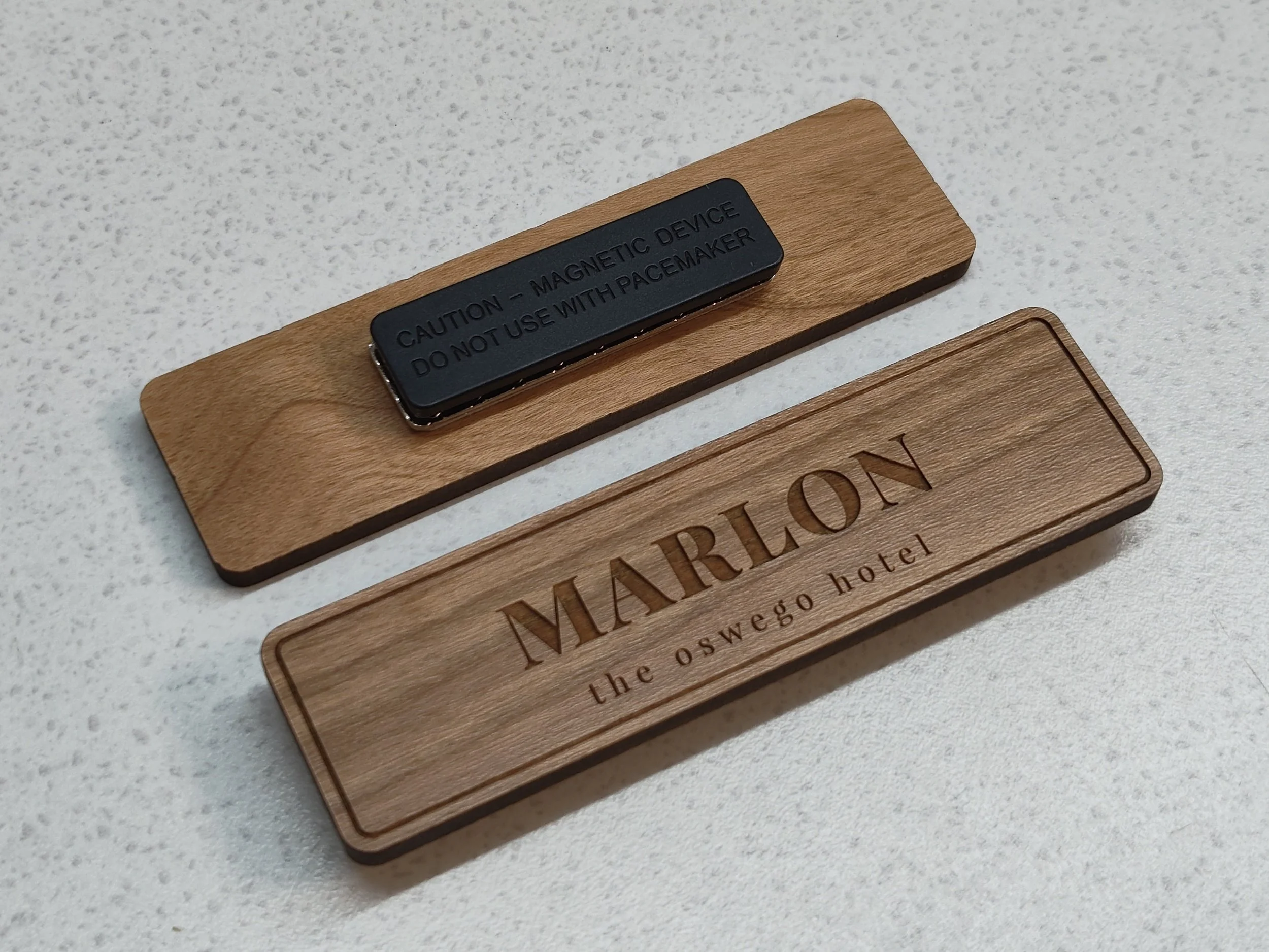 Cherry wood Truflat name tags made by Victoria Custom Laser with magnetic clasp