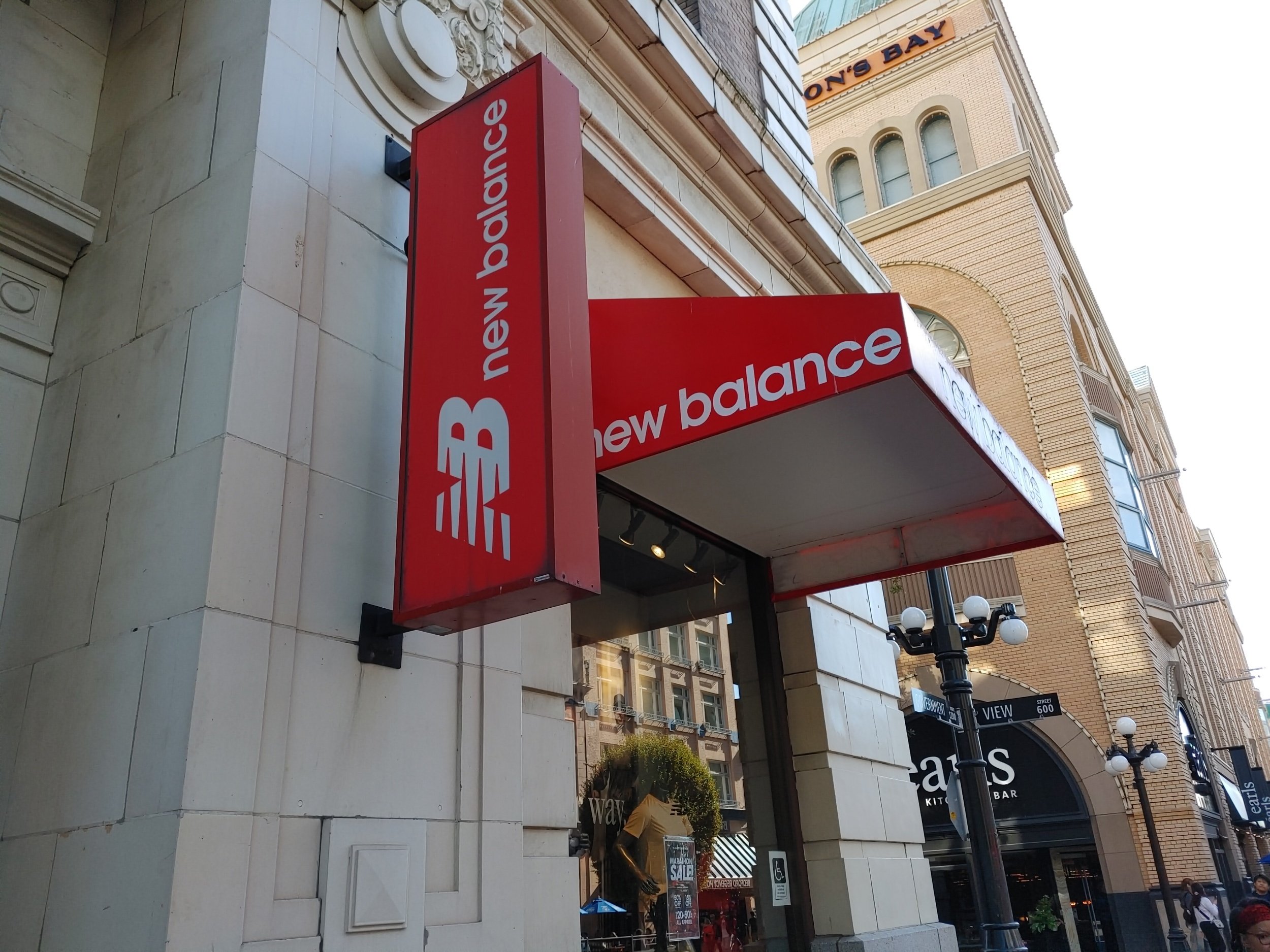New Balance store sign on a building exterior