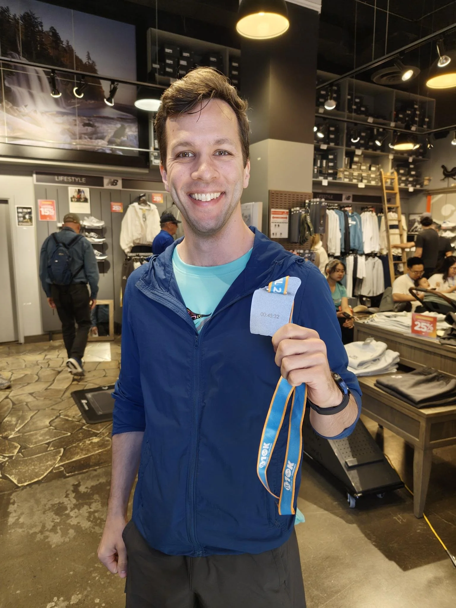 TC10K participant with their race medals laser engraved