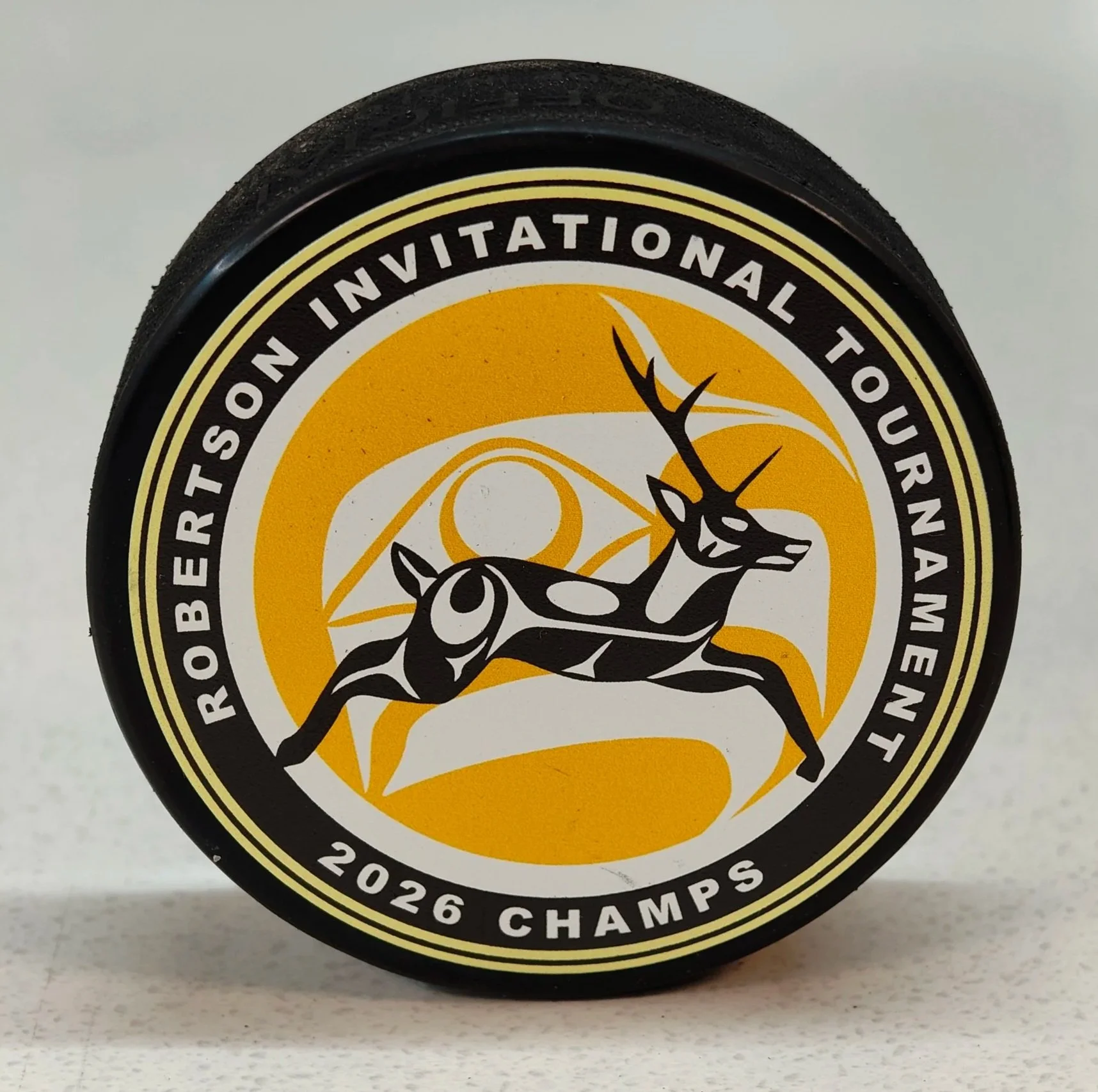 UV printed hockey puck for the Robertson Invitational hockey tournament